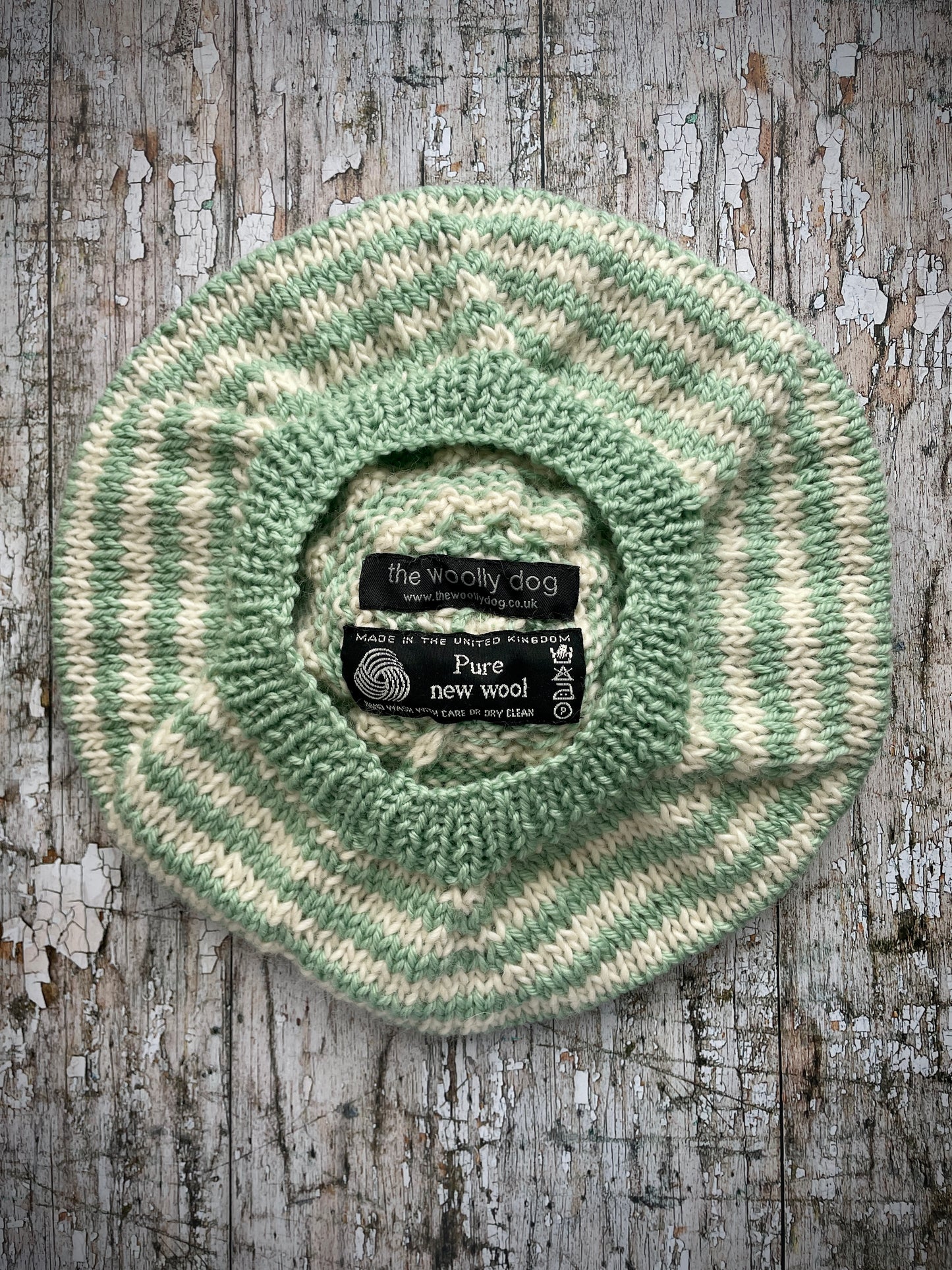 CHILDREN'S PISTACHIO + CREAM STRIPED WOOL BERET
Beautifully hand knitted beret in soft pure wool and merino wool, perfect for keeping little heads warm on cold days. Knitted in nautical Breton stripes of pistachio green and cream, with a big green pom and green ribbed band that gives the hat a snug fit. It would look lovely on boys or girls.

SIZE: child 6 - 24 mths.
Diameter approximately: 26cm / 10+1/4".
CARE: hand wash or machine wash on wool cycle at 30 degrees, dry flat, do not tumble dry.