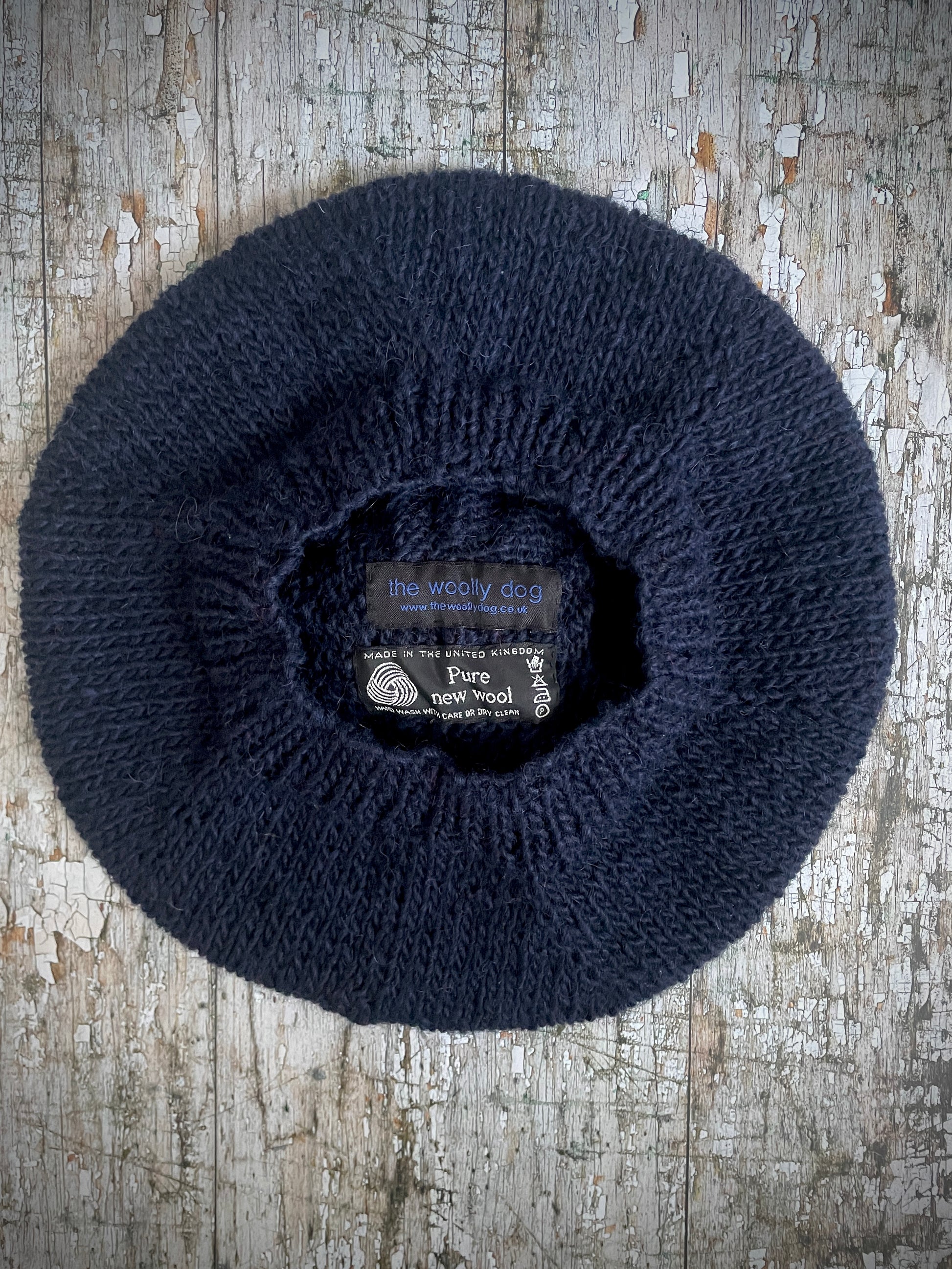 Hand Knitted Wool Beret Navy Blue + Red

Beautifully hand knitted beret in Icelandic pure wool, perfect for keeping your head warm on cold days. Knitted in a dark navy blue colour with a bright red pom and navy blue ribbed band that gives the hat a snug fit.

SIZE: adult.

CARE: hand wash or machine wash on wool cycle at 30 degrees, dry flat, do not tumble dry.