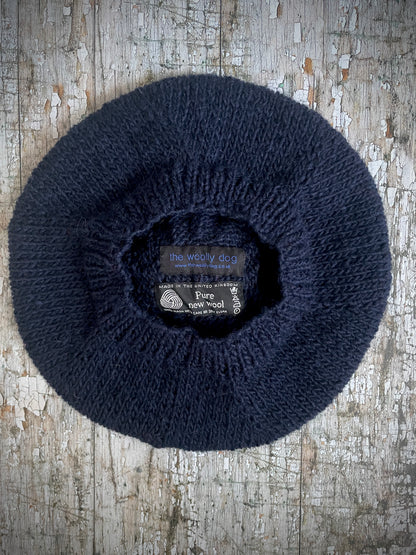 Hand Knitted Wool Beret Navy Blue + Red

Beautifully hand knitted beret in Icelandic pure wool, perfect for keeping your head warm on cold days. Knitted in a dark navy blue colour with a bright red pom and navy blue ribbed band that gives the hat a snug fit.

SIZE: adult.

CARE: hand wash or machine wash on wool cycle at 30 degrees, dry flat, do not tumble dry.