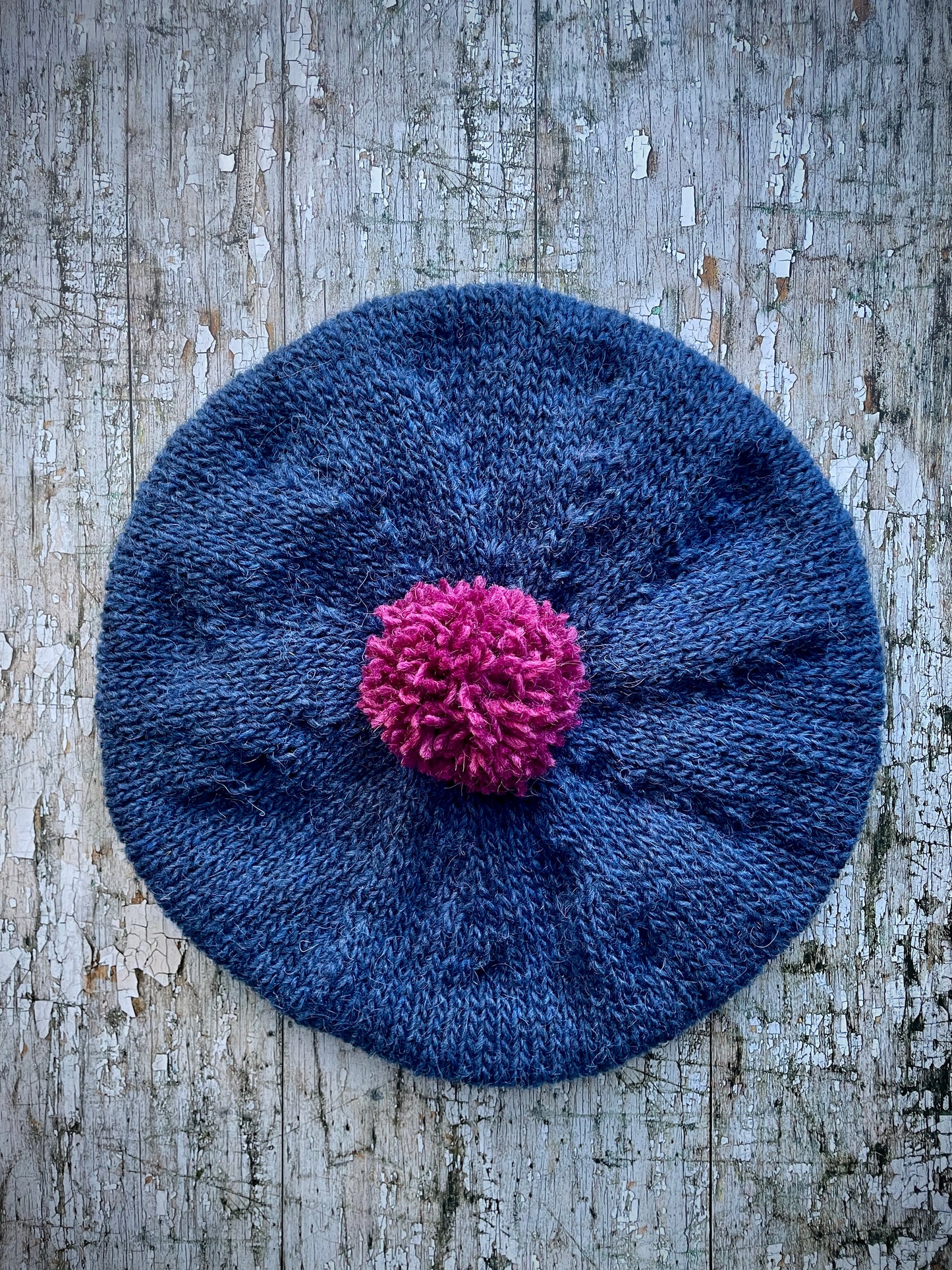 Hand Knitted Wool Indigo + Fuchsia Beret

Beautifully hand knitted beret in Icelandic pure wool, perfect for keeping your head warm on cold days. Knitted in a beautiful indigo blue, with a big fuchsia pom and indigo ribbed band that gives the hat a snug fit.

SIZE: adult.

CARE: hand wash or machine wash on wool cycle at 30 degrees, dry flat, do not tumble dry.