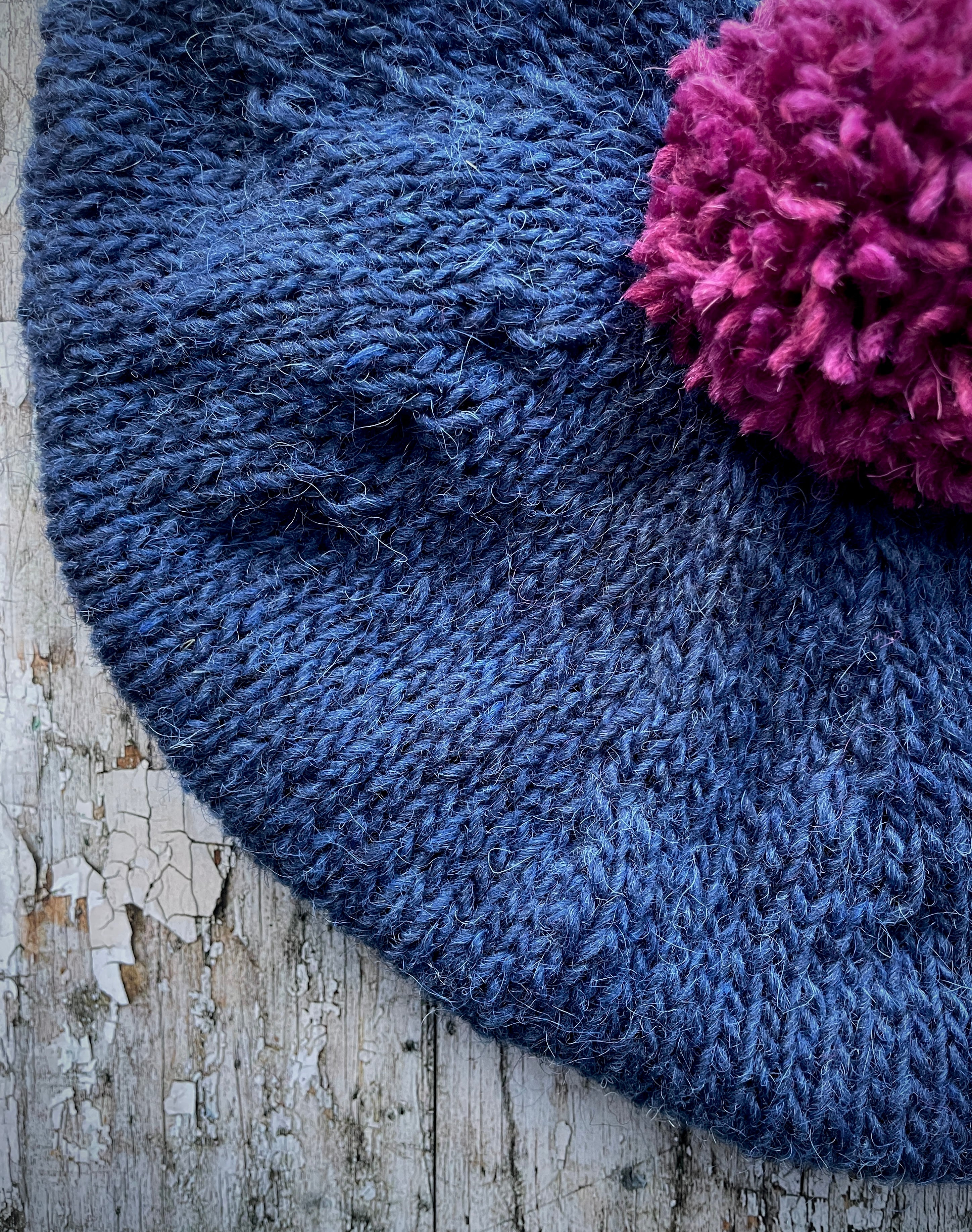 Hand Knitted Wool Indigo + Fuchsia Beret

Beautifully hand knitted beret in Icelandic pure wool, perfect for keeping your head warm on cold days. Knitted in a beautiful indigo blue, with a big fuchsia pom and indigo ribbed band that gives the hat a snug fit.

SIZE: adult.

CARE: hand wash or machine wash on wool cycle at 30 degrees, dry flat, do not tumble dry.