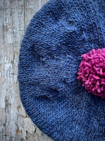 Hand Knitted Wool Indigo + Fuchsia Beret

Beautifully hand knitted beret in Icelandic pure wool, perfect for keeping your head warm on cold days. Knitted in a beautiful indigo blue, with a big fuchsia pom and indigo ribbed band that gives the hat a snug fit.

SIZE: adult.

CARE: hand wash or machine wash on wool cycle at 30 degrees, dry flat, do not tumble dry.