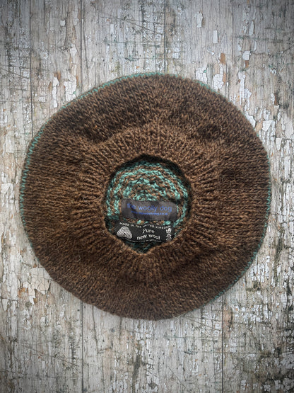 Dark Chocolate + Viridian Striped Wool Beret

Beautifully hand knitted with Icelandic pure new wool, in half plain dark chocolate and half viridian stripes, with a big viridian pom and a ribbed band that gives the hat a snug fit. Perfect for keeping your head warm on cold days.

SIZE: adult.

CARE: hand wash or machine wash on wool cycle at 30 degrees, dry flat, do not tumble dry.