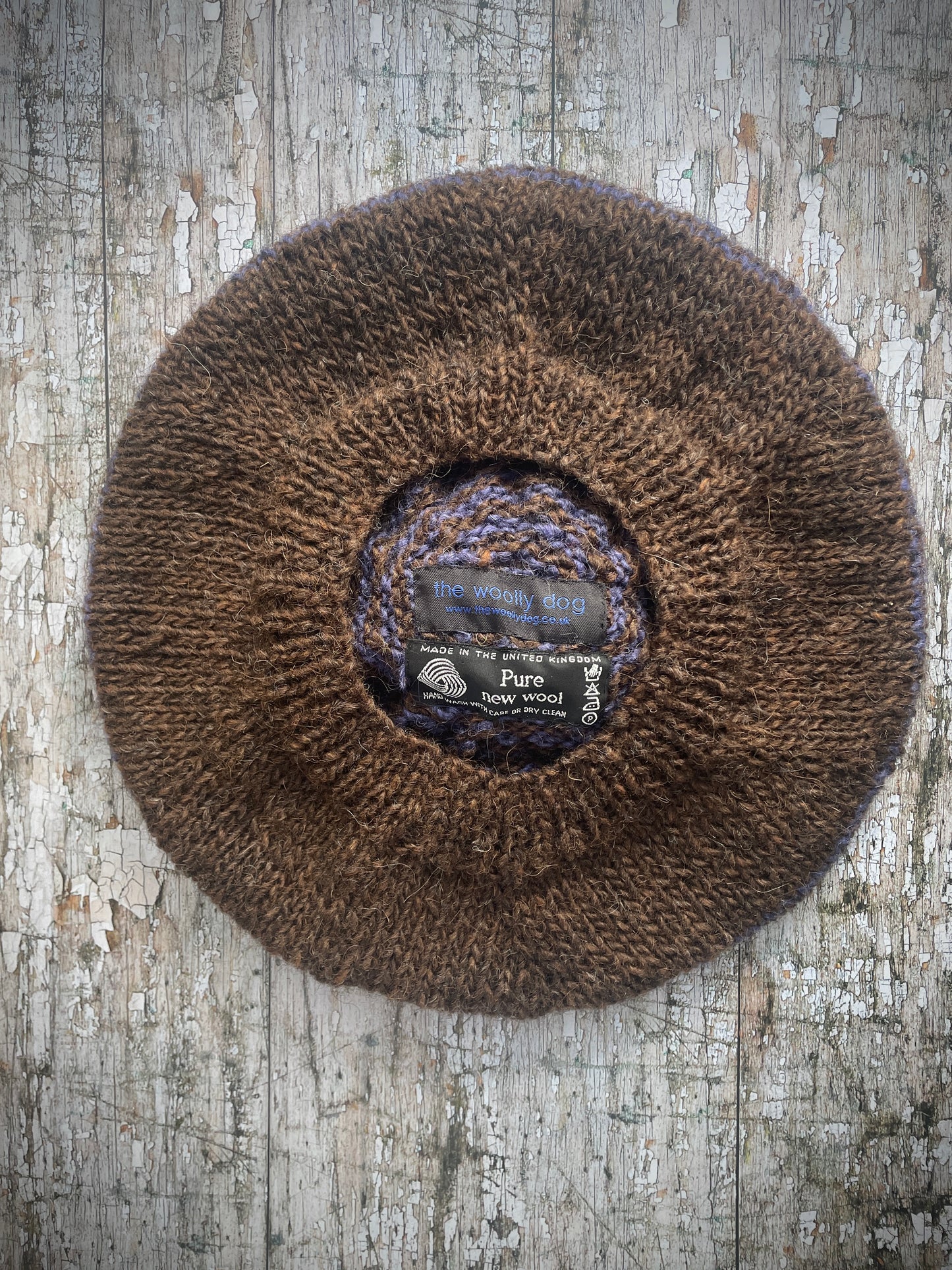 Dark Chocolate + Lavender Striped Wool Beret

Beautifully hand knitted with Icelandic pure new wool, in half plain dark chocolate brown and half lavender stripes, with a big chocolate brown pom and a ribbed band that gives the hat a snug fit. Perfect for keeping your head warm on cold days.

SIZE: adult.

CARE: hand wash or machine wash on wool cycle at 30 degrees, dry flat, do not tumble dry.