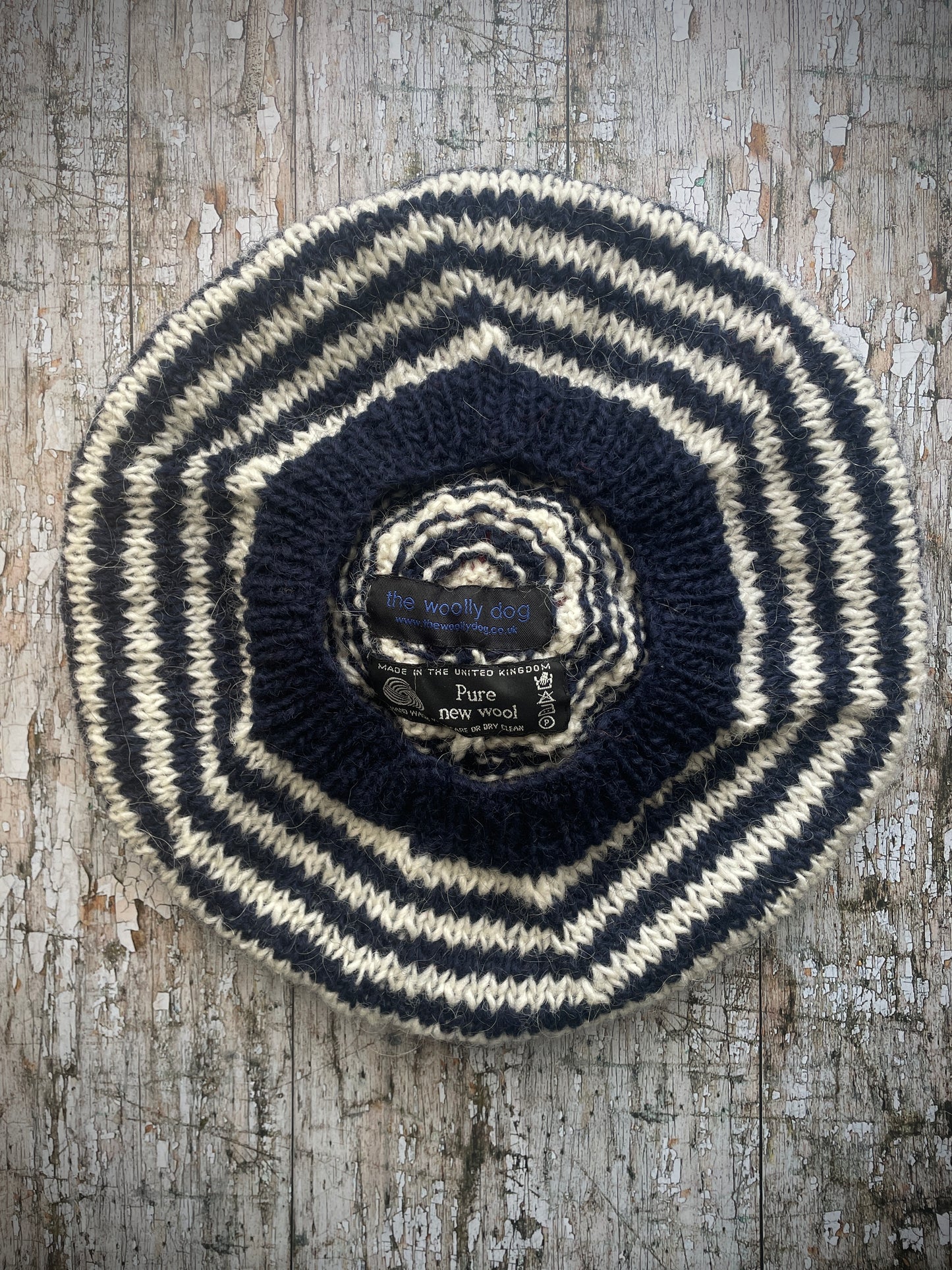 Navy Blue + White + Red Breton Stripes Wool Beret

Nautical style beret, beautifully hand knitted with Lettlopi pure new wool, in Breton stripes of navy blue and white, with a big red pom and a navy blue ribbed band that gives the hat a snug fit. Perfect for keeping your head warm on cold days.

SIZE: adult.

CARE: hand wash or machine wash on wool cycle at 30 degrees, dry flat, do not tumble dry.