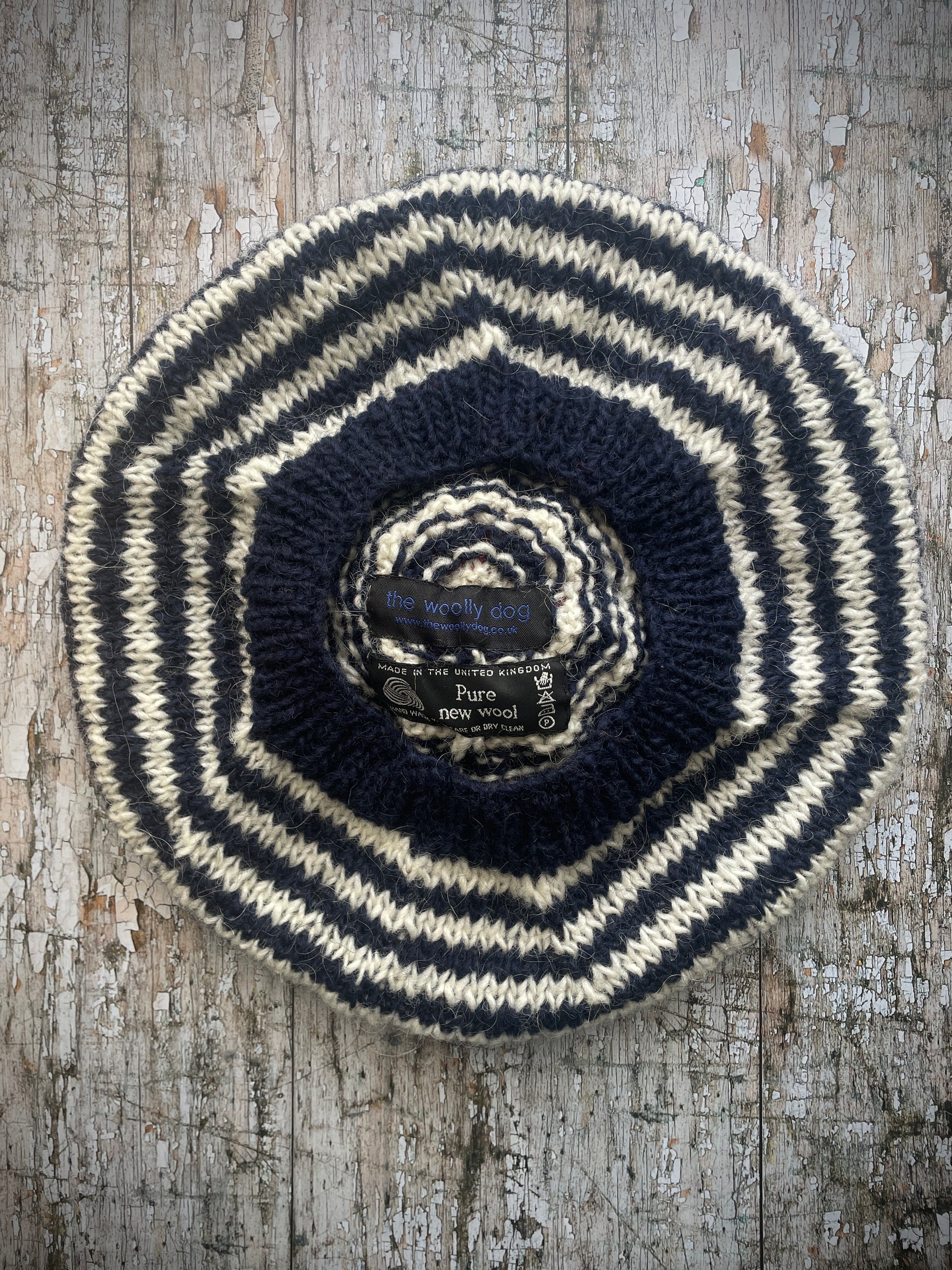 Navy Blue + White + Red Breton Stripes Wool Beret

Nautical style beret, beautifully hand knitted with Lettlopi pure new wool, in Breton stripes of navy blue and white, with a big red pom and a navy blue ribbed band that gives the hat a snug fit. Perfect for keeping your head warm on cold days.

SIZE: adult.

CARE: hand wash or machine wash on wool cycle at 30 degrees, dry flat, do not tumble dry.