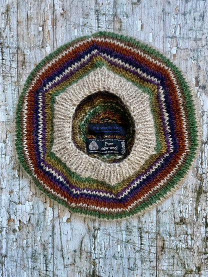 Beautifully hand knitted beret in Icelandic wool, perfect for keeping your head warm on cold days and adding a touch of 40's style to any outfit. Knitted in oat, sage green heather, dark kelp, violet heather, navy, burnt orange and milk chocolate stripes, with a green heather ribbed band that gives the hat a snug fit.

SIZE: adult.

CARE: hand wash or machine wash on wool cycle at 30 degrees, dry flat, do not tumble dry.