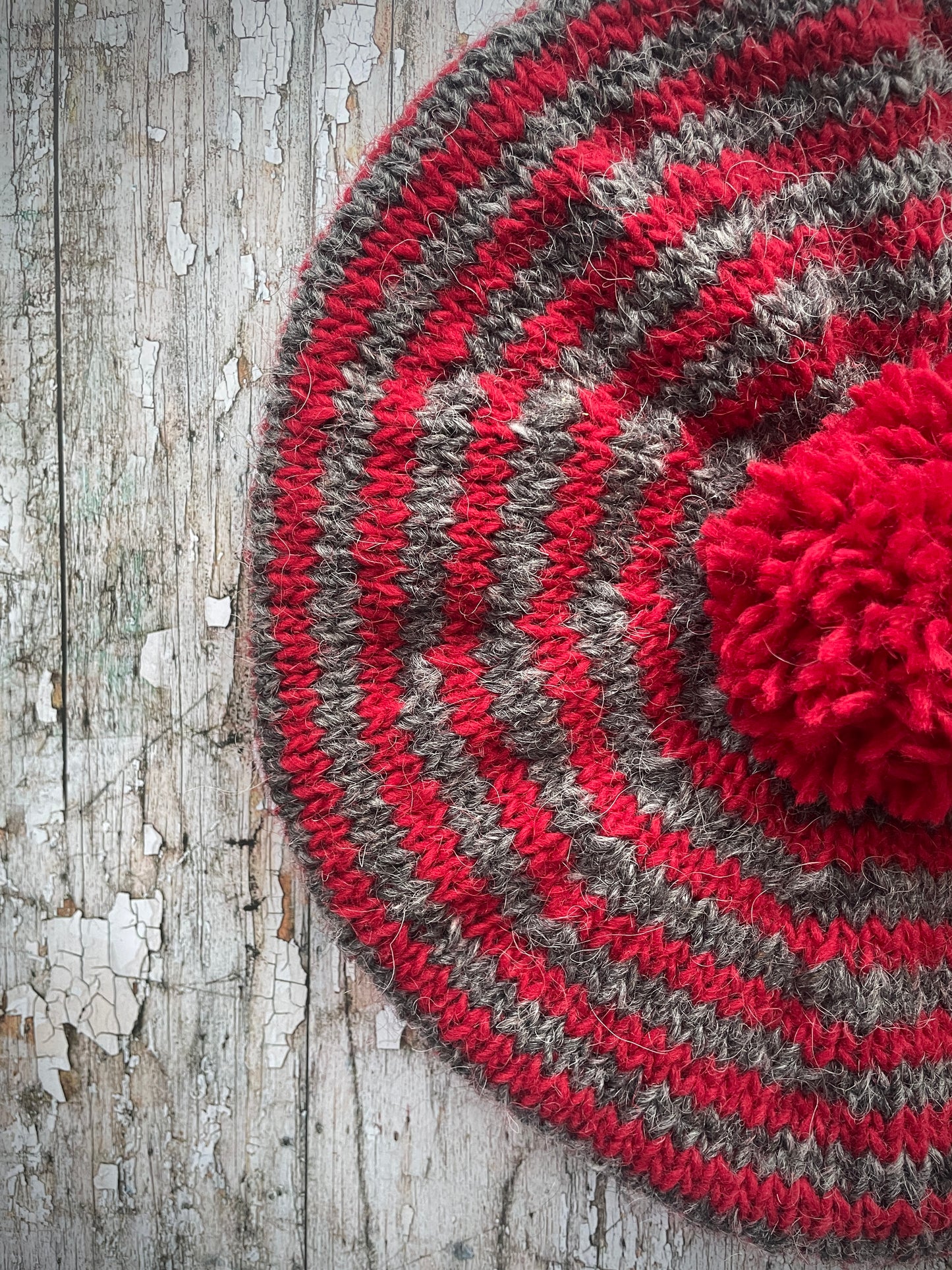 Red + Grey Breton Stripes Wool Beret

Nautical style beret, beautifully hand knitted with Icelandic pure new wool, in Breton stripes of red and grey with a big red pom&nbsp;and a red ribbed band that gives the hat a snug fit. Perfect for keeping your head warm on cold days.

SIZE: adult.

CARE: hand wash or machine wash on wool cycle at 30 degrees, dry flat, do not tumble dry.