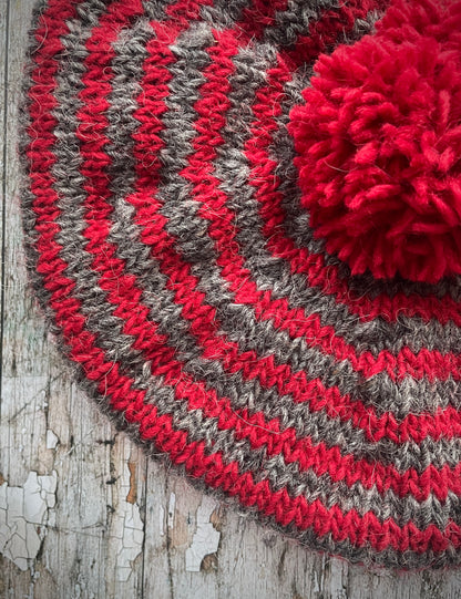 Red + Grey Breton Stripes Wool Beret

Nautical style beret, beautifully hand knitted with Icelandic pure new wool, in Breton stripes of red and grey with a big red pom&nbsp;and a red ribbed band that gives the hat a snug fit. Perfect for keeping your head warm on cold days.

SIZE: adult.

CARE: hand wash or machine wash on wool cycle at 30 degrees, dry flat, do not tumble dry.