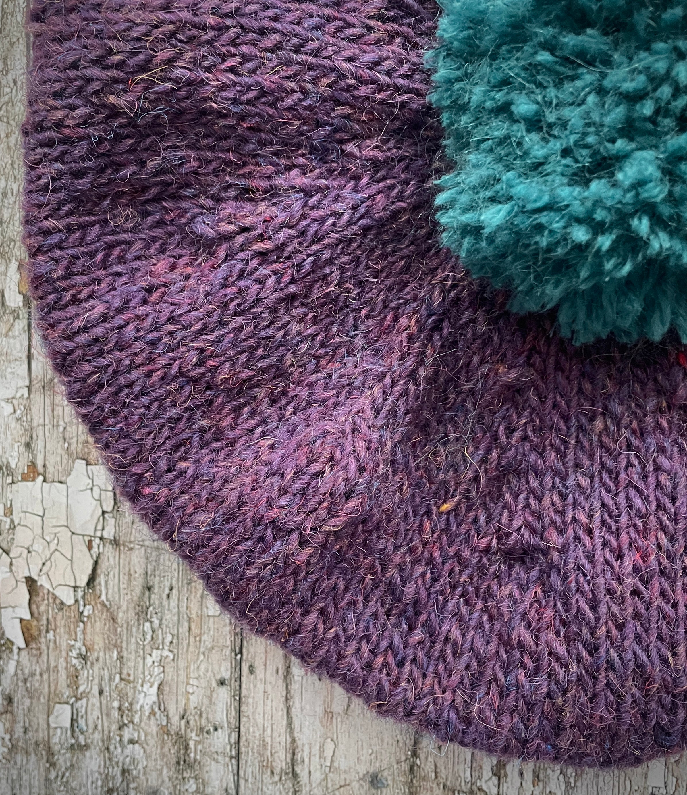 Hand Knitted Wool Beret Violet Heather + Viridian

Beautifully hand knitted beret in Icelandic pure wool, perfect for keeping your head warm on cold days. Knitted in a beautiful violet heather with a big viridian pom and viridian ribbed band that gives the hat a snug fit.

SIZE: adult.

DIAMETER: 11" / 28cm.

CARE: hand wash or machine wash on wool cycle at 30 degrees, dry flat, do not tumble dry.