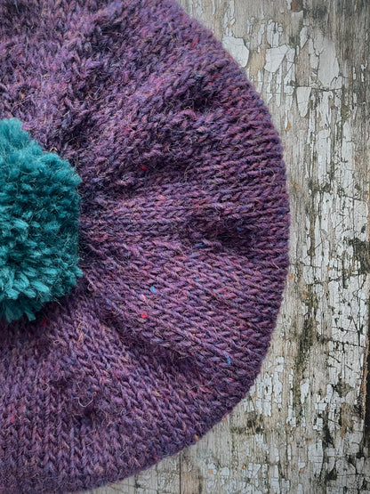 Hand Knitted Wool Beret Violet Heather + Viridian

Beautifully hand knitted beret in Icelandic pure wool, perfect for keeping your head warm on cold days. Knitted in a beautiful violet heather with a big viridian pom and viridian ribbed band that gives the hat a snug fit.

SIZE: adult.

DIAMETER: 11" / 28cm.

CARE: hand wash or machine wash on wool cycle at 30 degrees, dry flat, do not tumble dry.