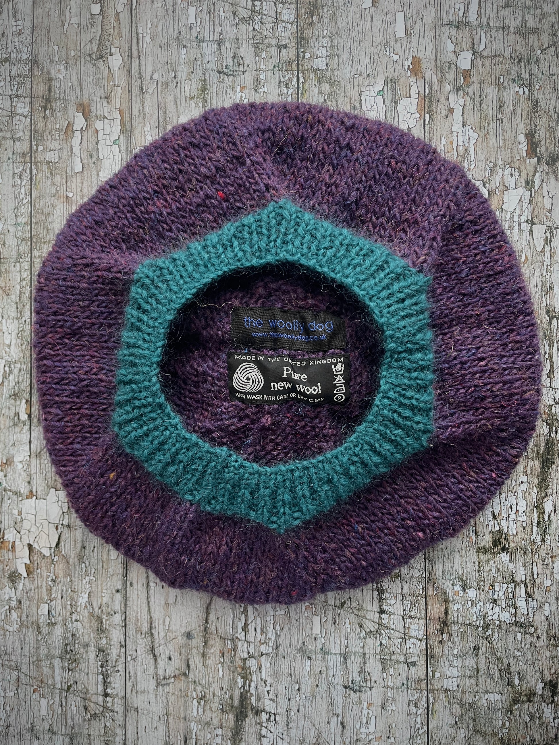 Hand Knitted Wool Beret Violet Heather + Viridian

Beautifully hand knitted beret in Icelandic pure wool, perfect for keeping your head warm on cold days. Knitted in a beautiful violet heather with a big viridian pom and viridian ribbed band that gives the hat a snug fit.

SIZE: adult.

DIAMETER: 11" / 28cm.

CARE: hand wash or machine wash on wool cycle at 30 degrees, dry flat, do not tumble dry.