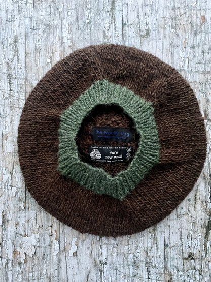 Hand Knitted Wool Beret Dark Chocolate + Sage Green Heather

Beautifully hand knitted beret in Icelandic pure wool, perfect for keeping your head warm on cold days. Knitted in a lovely dark chocolate brown colour with a sage green pom and ribbed band that gives the hat a snug fit.

SIZE: adult.

CARE: hand wash or machine wash on wool cycle at 30 degrees, dry flat, do not tumble dry.