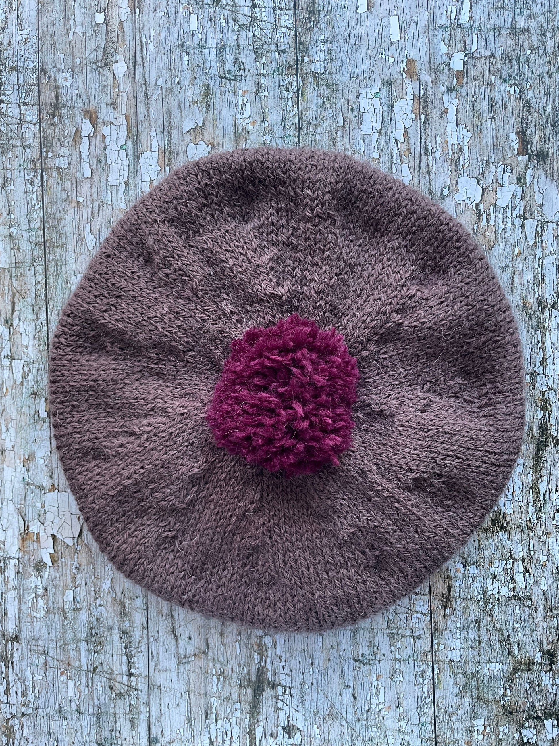 Hand Knitted Wool Beret In Umber + Mulberry

Beautifully hand knitted beret with West Yorkshire Spinners wool, alpaca and mohair in an umber colour, perfect for keeping your head warm on cold days, with a big pom and ribbed band that gives the hat a snug fit in a mix of Rowan wool and mohair in mulberry

SIZE: adult.

CARE: hand wash or machine wash on wool cycle at 30 degrees, dry flat, do not tumble dry.