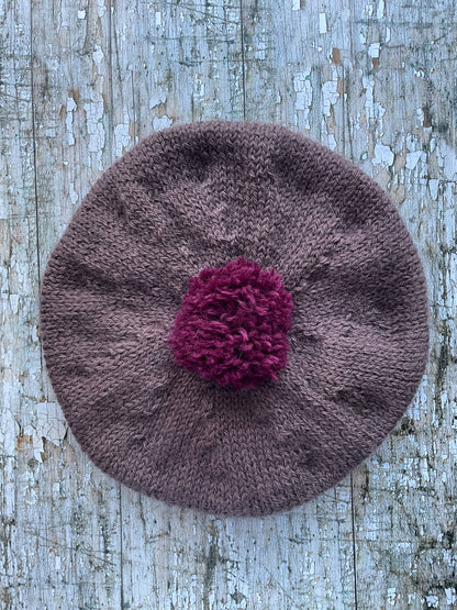 Hand Knitted Wool Beret In Umber + Mulberry

Beautifully hand knitted beret with West Yorkshire Spinners wool, alpaca and mohair in an umber colour, perfect for keeping your head warm on cold days, with a big pom and ribbed band that gives the hat a snug fit in a mix of Rowan wool and mohair in mulberry

SIZE: adult.

CARE: hand wash or machine wash on wool cycle at 30 degrees, dry flat, do not tumble dry.
