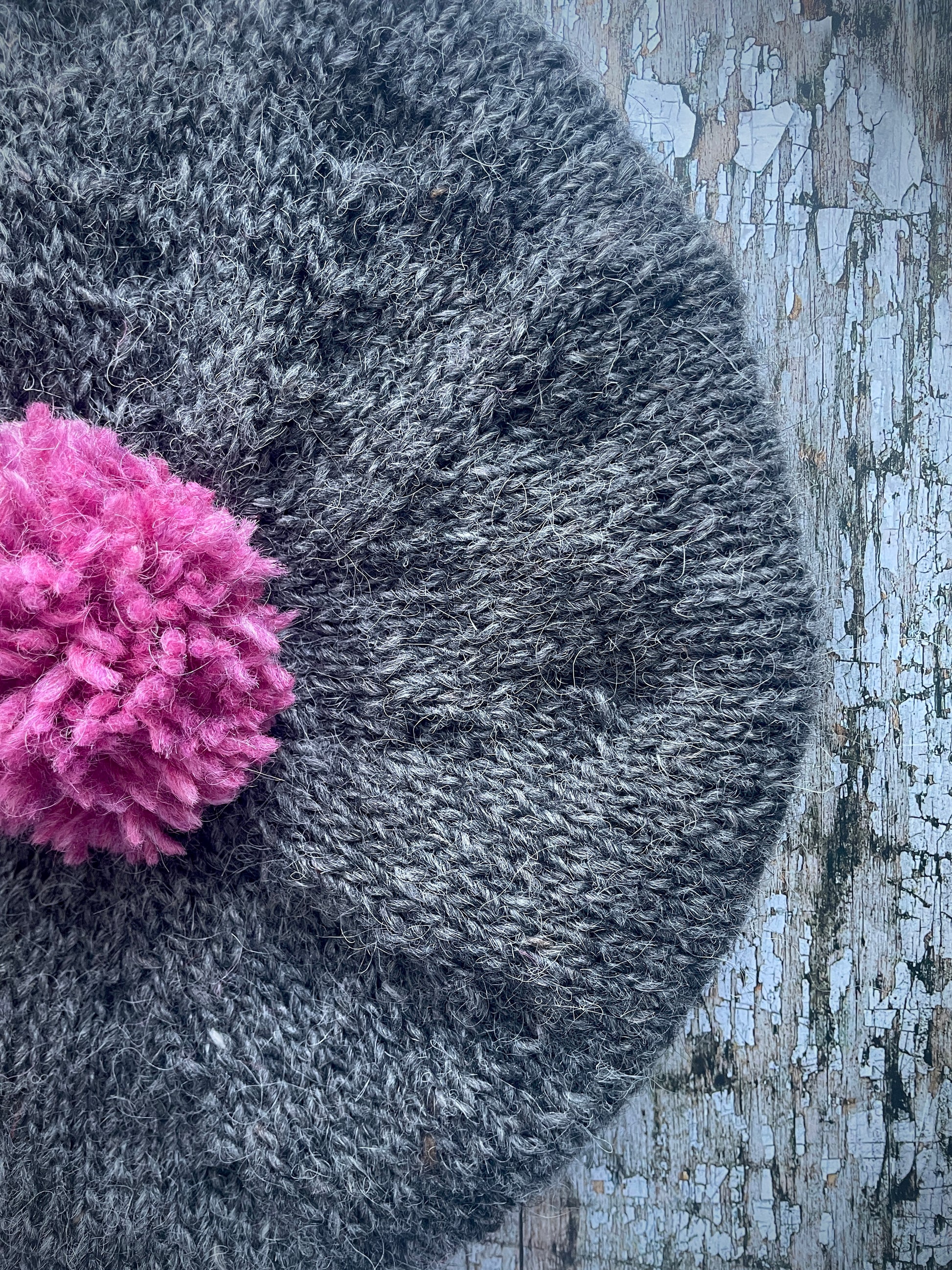 Hand Knitted Wool Beret Grey Tweed + Pink Heather

Beautifully hand knitted beret in Icelandic pure wool, perfect for keeping your head warm on cold days. Knitted in a grey tweed, with a big pink pom and pink ribbed band that gives the hat a snug fit.

SIZE: adult.

CARE: hand wash or machine wash on wool cycle at 30 degrees, dry flat, do not tumble dry.