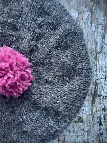 Hand Knitted Wool Beret Grey Tweed + Pink Heather

Beautifully hand knitted beret in Icelandic pure wool, perfect for keeping your head warm on cold days. Knitted in a grey tweed, with a big pink pom and pink ribbed band that gives the hat a snug fit.

SIZE: adult.

CARE: hand wash or machine wash on wool cycle at 30 degrees, dry flat, do not tumble dry.