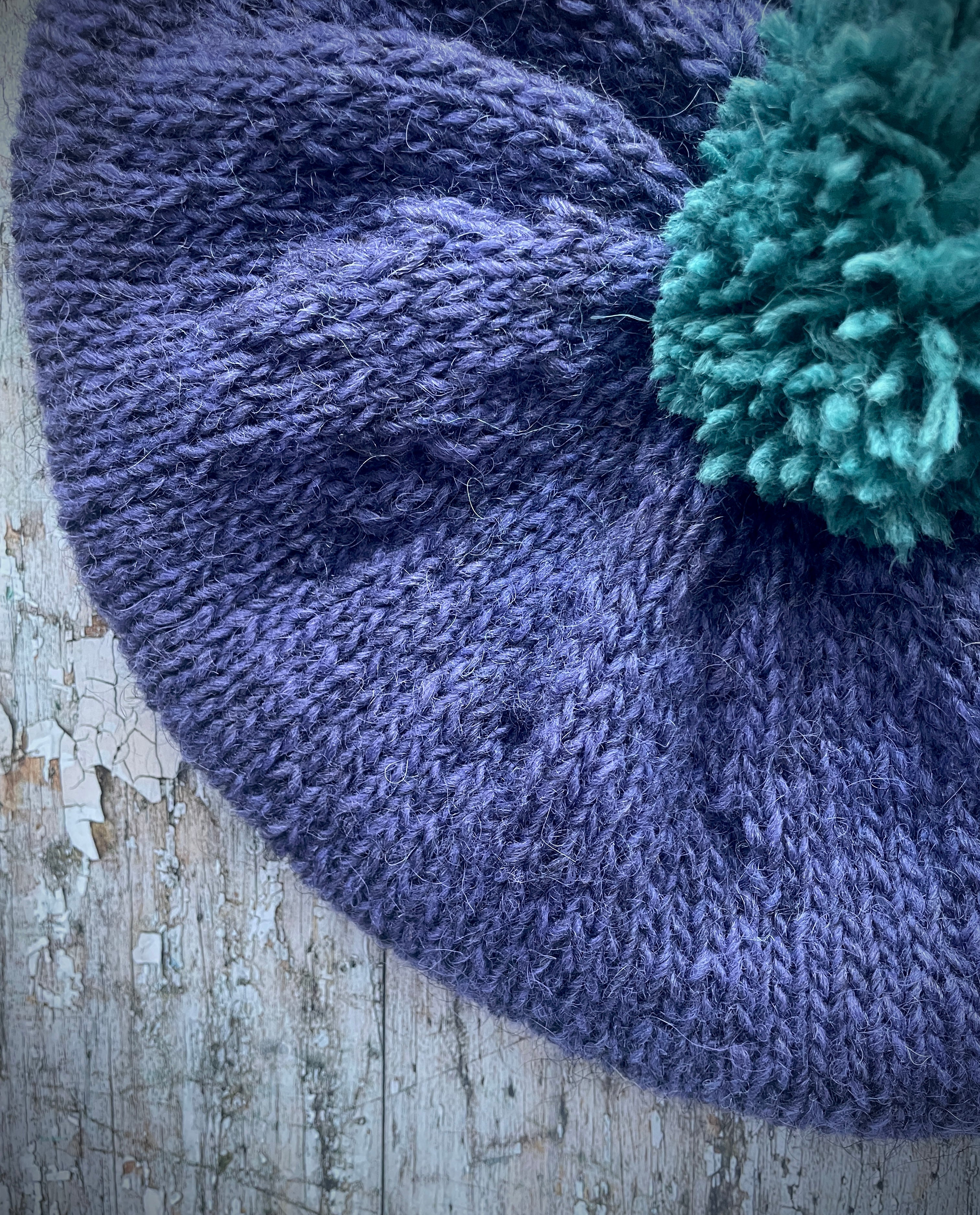 Hand Knitted Wool Lavender + Viridian Beret

Beautifully hand knitted beret in Icelandic pure wool, perfect for keeping your head warm on cold days. Knitted in a deep lavender, with a big viridian pom and a ribbed band that gives the hat a snug fit.

SIZE: adult.

CARE: hand wash or machine wash on wool cycle at 30 degrees, dry flat, do not tumble dry.