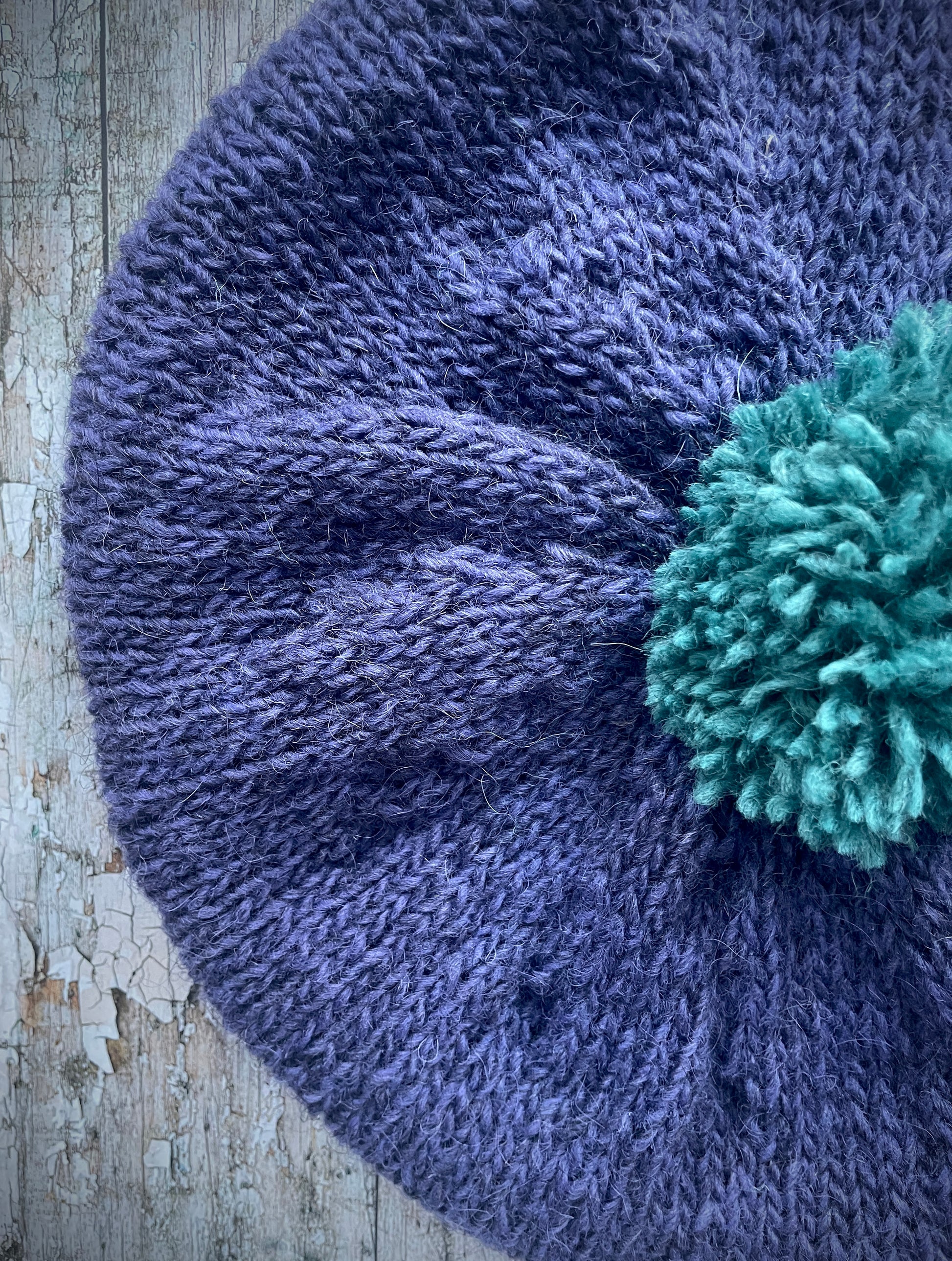Hand Knitted Wool Lavender + Viridian Beret

Beautifully hand knitted beret in Icelandic pure wool, perfect for keeping your head warm on cold days. Knitted in a deep lavender, with a big viridian pom and a ribbed band that gives the hat a snug fit.

SIZE: adult.

CARE: hand wash or machine wash on wool cycle at 30 degrees, dry flat, do not tumble dry.