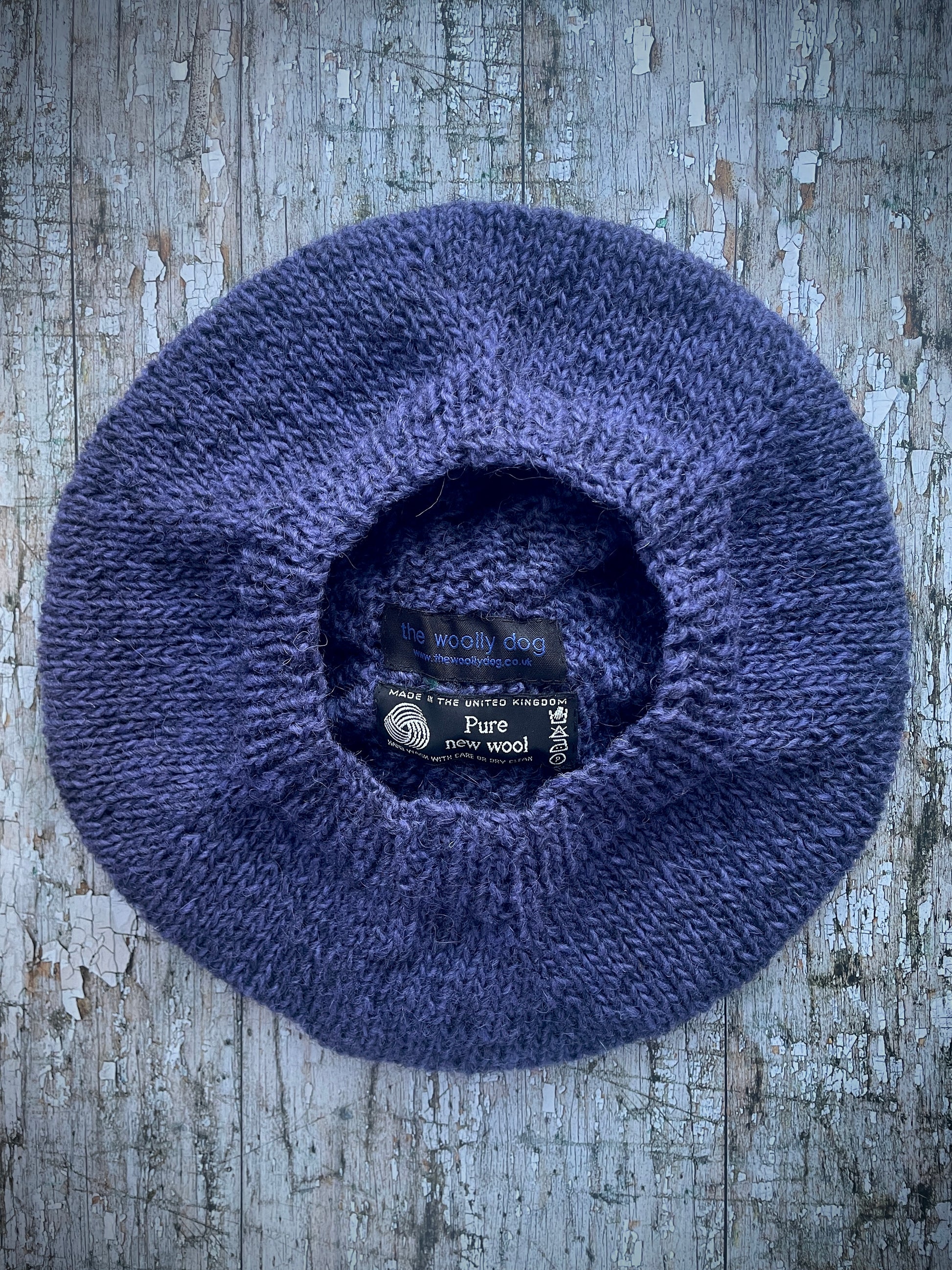 Hand Knitted Wool Lavender + Viridian Beret

Beautifully hand knitted beret in Icelandic pure wool, perfect for keeping your head warm on cold days. Knitted in a deep lavender, with a big viridian pom and a ribbed band that gives the hat a snug fit.

SIZE: adult.

CARE: hand wash or machine wash on wool cycle at 30 degrees, dry flat, do not tumble dry.