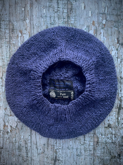 Hand Knitted Wool Lavender + Viridian Beret

Beautifully hand knitted beret in Icelandic pure wool, perfect for keeping your head warm on cold days. Knitted in a deep lavender, with a big viridian pom and a ribbed band that gives the hat a snug fit.

SIZE: adult.

CARE: hand wash or machine wash on wool cycle at 30 degrees, dry flat, do not tumble dry.