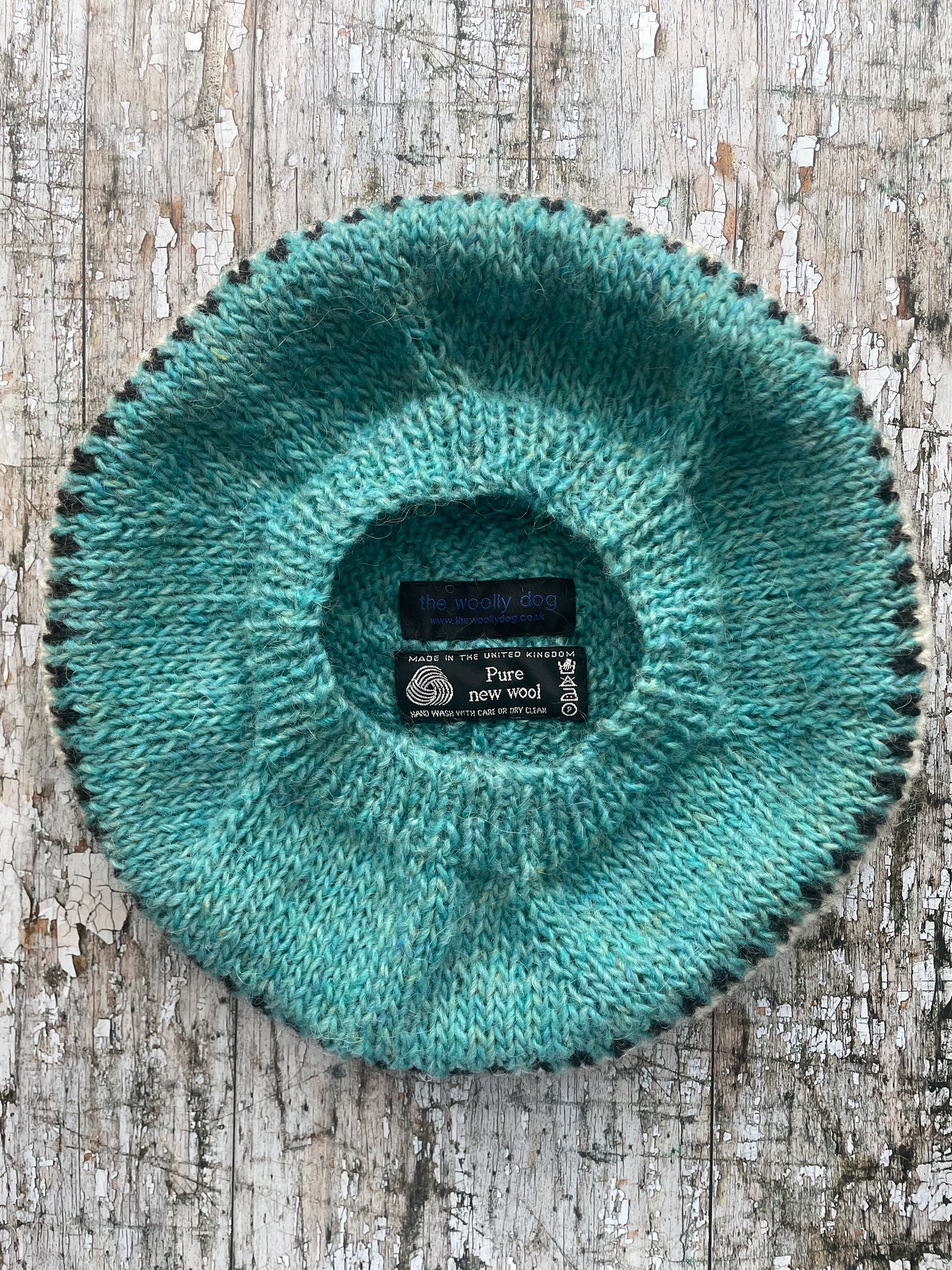 Hand Knitted Wool Beret Aqua

Beautifully hand knitted beret in Icelandic pure wool, perfect for keeping your head warm on cold days, knitted in a pretty aqua colour, with a&nbsp; pattern of graphite and white and a ribbed band that gives the hat a snug fit.

SIZE: adult.

DIAMETER: 11+1/4" / 28.5cm.

CARE: hand wash or machine wash on wool cycle at 30 degrees, dry flat, do not tumble dry.