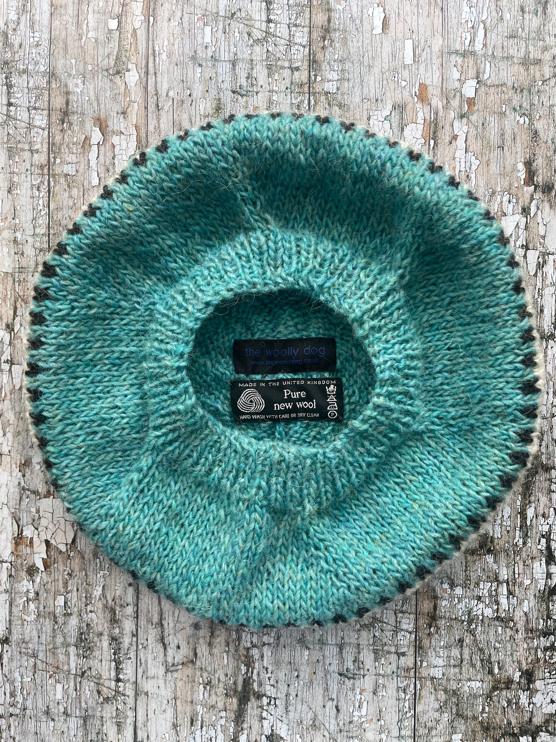 Hand Knitted Wool Beret Aqua

Beautifully hand knitted beret in Icelandic pure wool, perfect for keeping your head warm on cold days, knitted in a pretty aqua colour, with a&nbsp; pattern of graphite and white and a ribbed band that gives the hat a snug fit.

SIZE: adult.

DIAMETER: 11+1/4" / 28.5cm.

CARE: hand wash or machine wash on wool cycle at 30 degrees, dry flat, do not tumble dry.