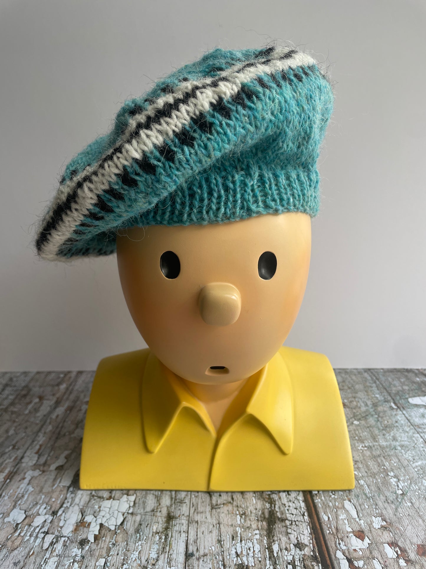 Hand Knitted Wool Beret Aqua

Beautifully hand knitted beret in Icelandic pure wool, perfect for keeping your head warm on cold days, knitted in a pretty aqua colour, with a&nbsp; pattern of graphite and white and a ribbed band that gives the hat a snug fit.

SIZE: adult.

DIAMETER: 11+1/4" / 28.5cm.

CARE: hand wash or machine wash on wool cycle at 30 degrees, dry flat, do not tumble dry.