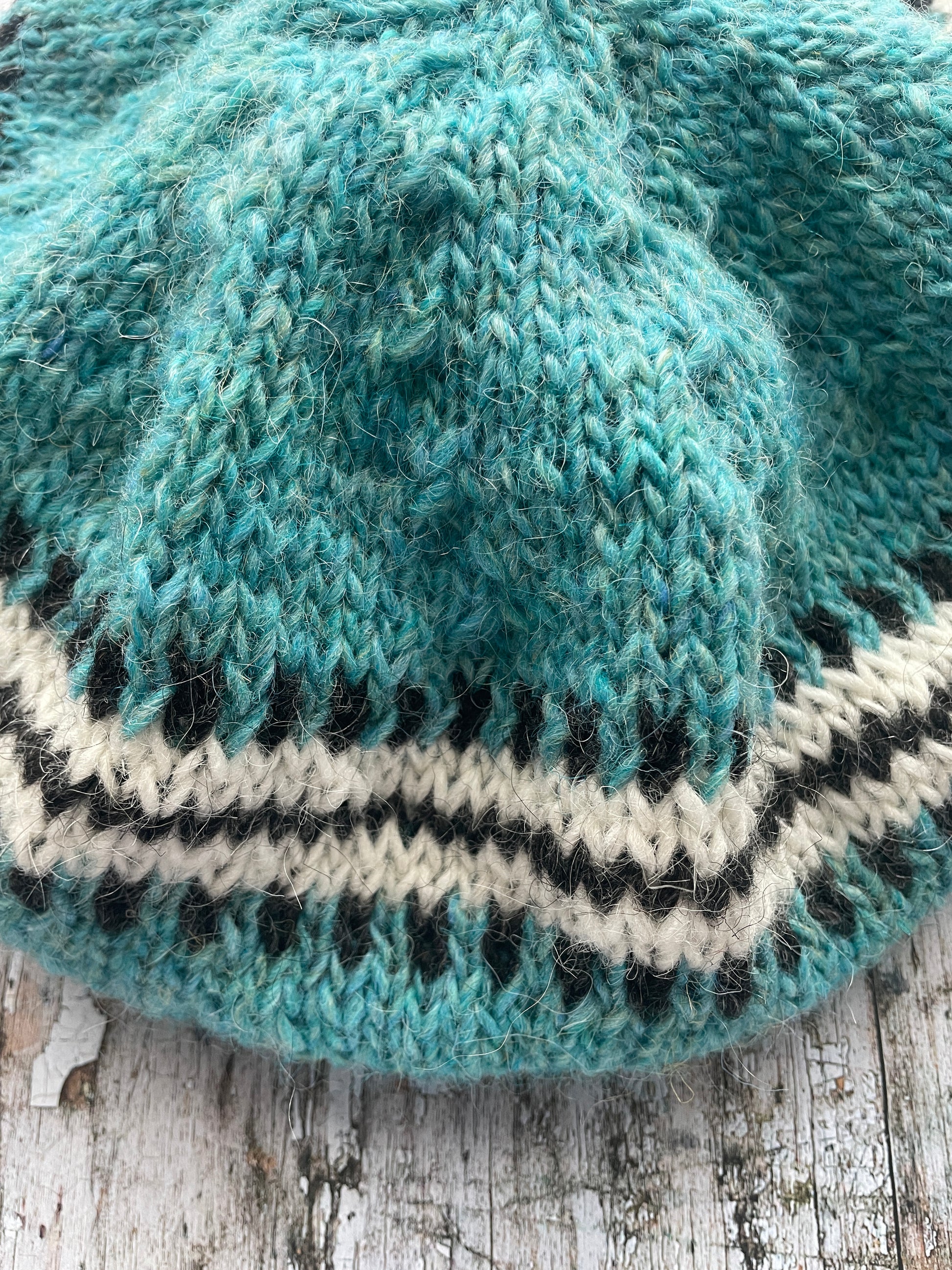 Hand Knitted Wool Beret Aqua

Beautifully hand knitted beret in Icelandic pure wool, perfect for keeping your head warm on cold days, knitted in a pretty aqua colour, with a&nbsp; pattern of graphite and white and a ribbed band that gives the hat a snug fit.

SIZE: adult.

DIAMETER: 11+1/4" / 28.5cm.

CARE: hand wash or machine wash on wool cycle at 30 degrees, dry flat, do not tumble dry.