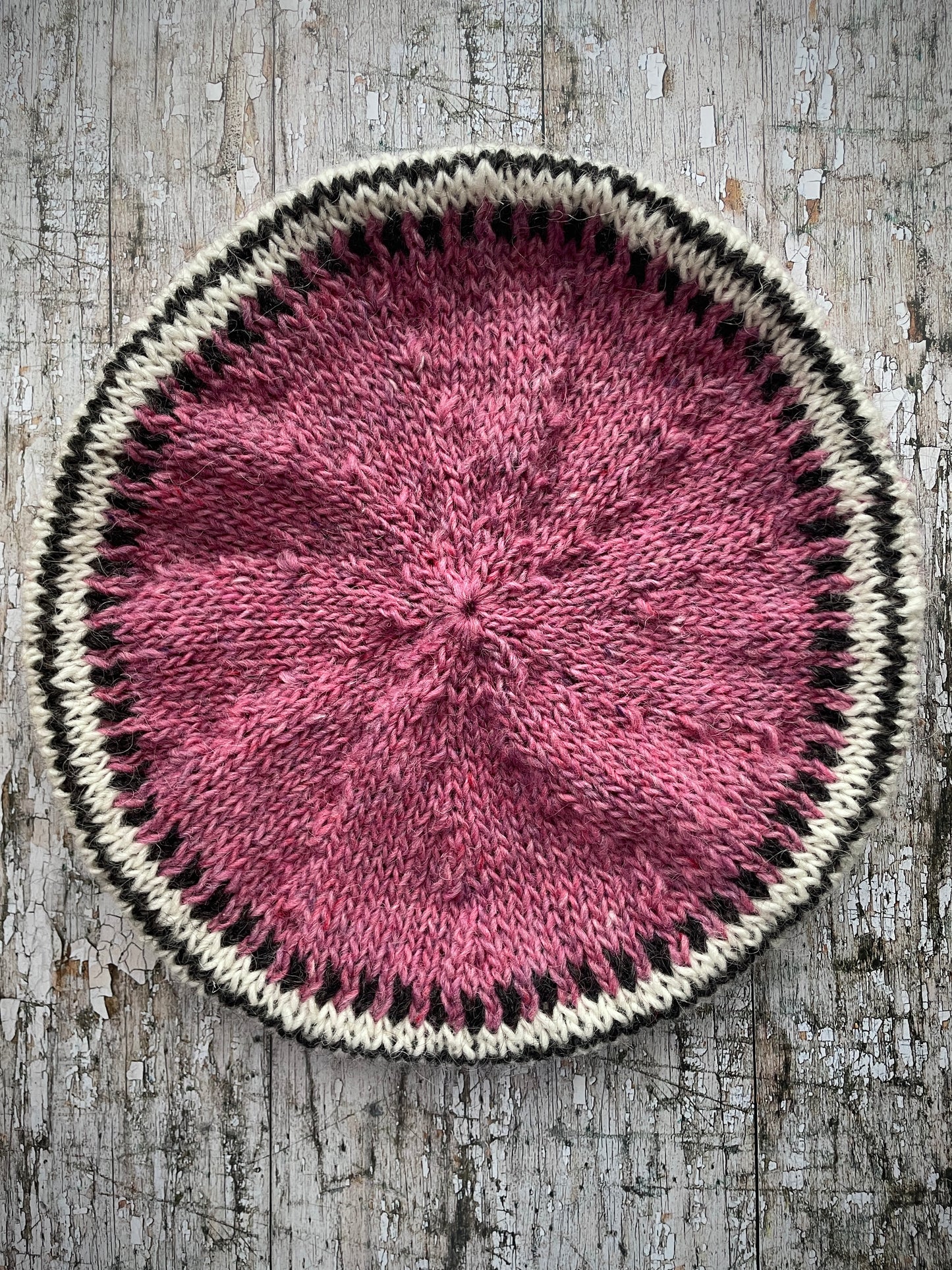 Hand Knitted Wool Beret Pink Heather

Beautifully hand knitted beret in Icelandic pure wool, perfect for keeping your head warm on cold days, knitted in a pink heather, with a&nbsp; pattern of graphite and white and a ribbed band that gives the hat a snug fit.&nbsp;

SIZE: adult.

DIAMETER: 11+3/4" / 30cm.

CARE: hand wash or machine wash on wool cycle at 30 degrees, dry flat, do not tumble dry.