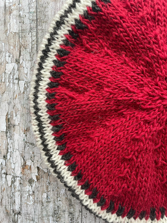 Hand Knitted Wool Beret Red

Beautifully hand knitted beret in Icelandic pure wool, perfect for keeping your head warm on cold days, knitted in red, with a&nbsp; pattern of graphite and white and a ribbed band that gives the hat a snug fit.&nbsp;

SIZE: adult.

DIAMETER: 11+3/4" / 30cm.

CARE: hand wash or machine wash on wool cycle at 30 degrees, dry flat, do not tumble dry.