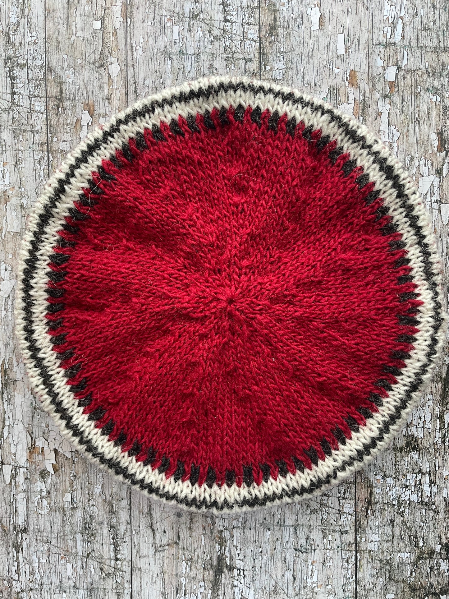 Hand Knitted Wool Beret Red

Beautifully hand knitted beret in Icelandic pure wool, perfect for keeping your head warm on cold days, knitted in red, with a&nbsp; pattern of graphite and white and a ribbed band that gives the hat a snug fit.&nbsp;

SIZE: adult.

DIAMETER: 11+3/4" / 30cm.

CARE: hand wash or machine wash on wool cycle at 30 degrees, dry flat, do not tumble dry.