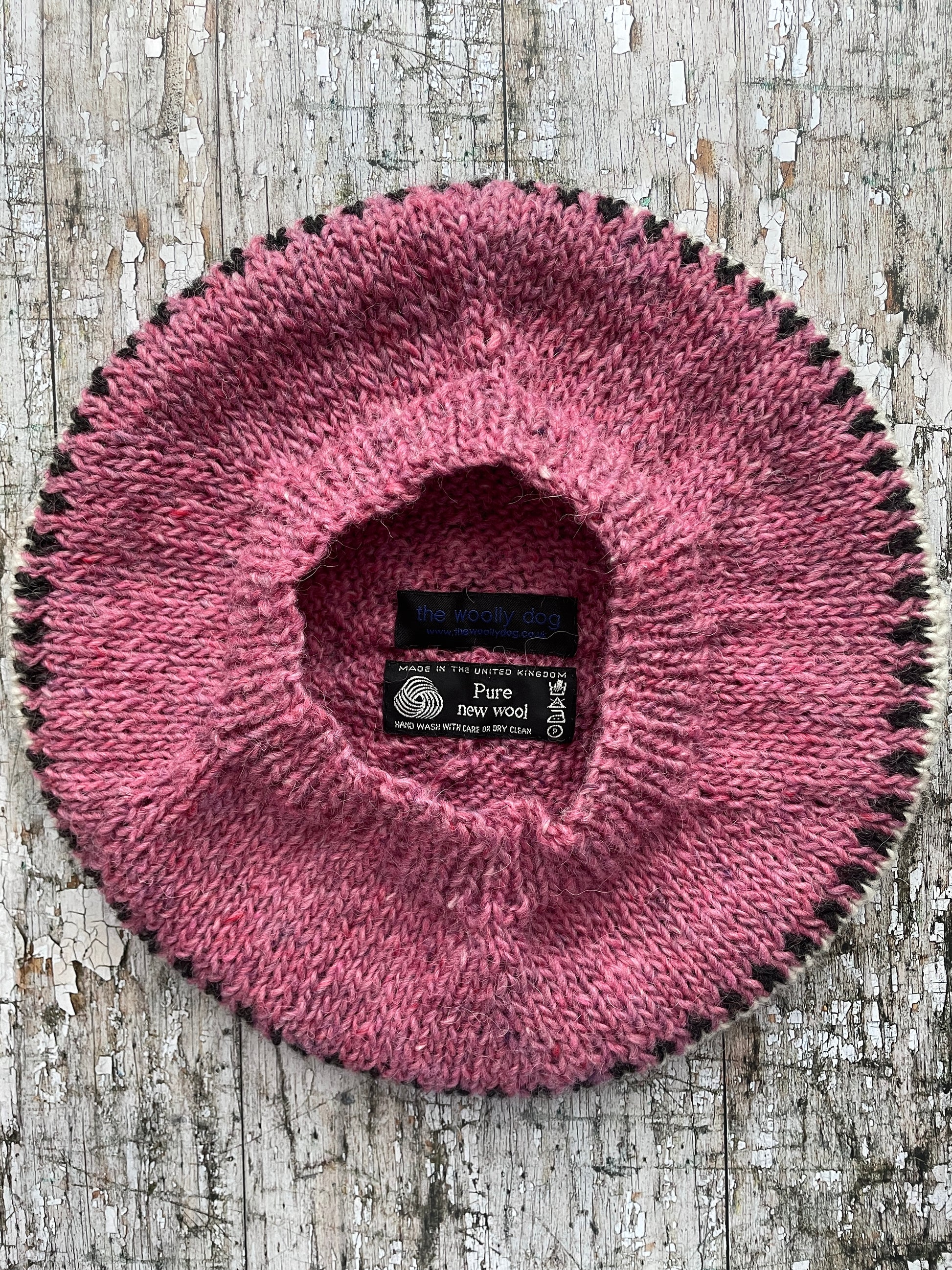 Hand Knitted Wool Beret Pink Heather

Beautifully hand knitted beret in Icelandic pure wool, perfect for keeping your head warm on cold days, knitted in a pink heather, with a&nbsp; pattern of graphite and white and a ribbed band that gives the hat a snug fit.

SIZE: adult.

DIAMETER: 11+3/4" / 30cm.

CARE: hand wash or machine wash on wool cycle at 30 degrees, dry flat, do not tumble dry.