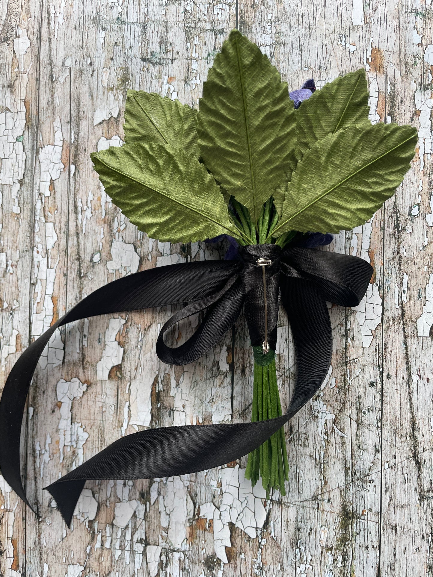 Lavender Violets + Green Leaves Gothic Brooch

This brooch contains unused old stock vintage millinery flowers, therefore like all vintage and antique items they may show slight signs of age.
Perfect as a gift for a vintage fan, dressing up, costumes, display and photo props.

Measurements Approximately:
Width: 12 cm / 4+3/4"
Length: 18 cm / 7"

