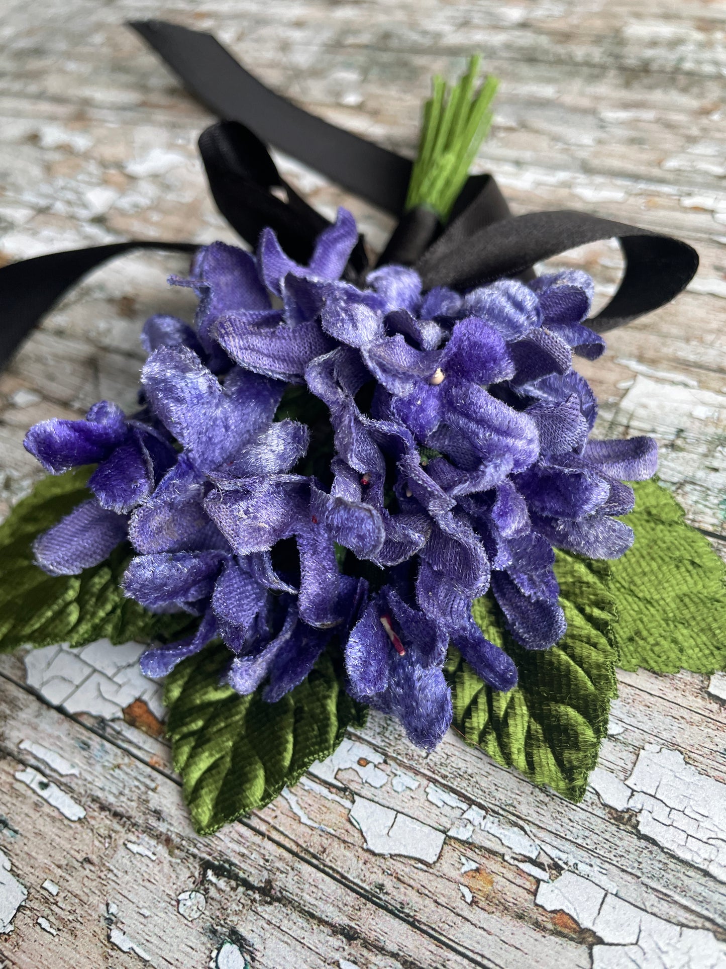 Lavender Violets + Green Leaves Gothic Brooch

This brooch contains unused old stock vintage millinery flowers, therefore like all vintage and antique items they may show slight signs of age.
Perfect as a gift for a vintage fan, dressing up, costumes, display and photo props.

Measurements Approximately:
Width: 12 cm / 4+3/4"
Length: 18 cm / 7"
