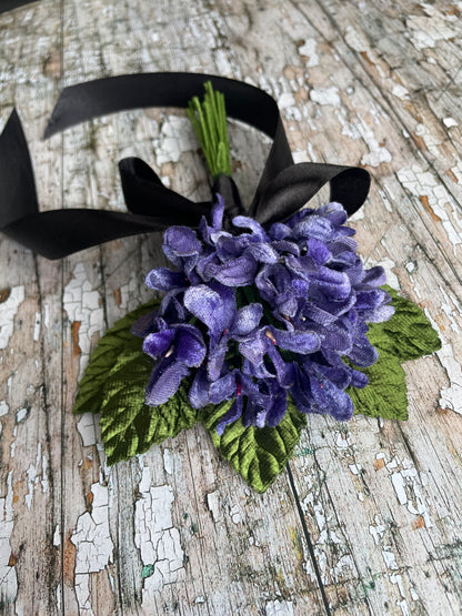 Lavender Violets + Green Leaves Gothic Brooch

This brooch contains unused old stock vintage millinery flowers, therefore like all vintage and antique items they may show slight signs of age.
Perfect as a gift for a vintage fan, dressing up, costumes, display and photo props.

Measurements Approximately:
Width: 12 cm / 4+3/4"
Length: 18 cm / 7"
