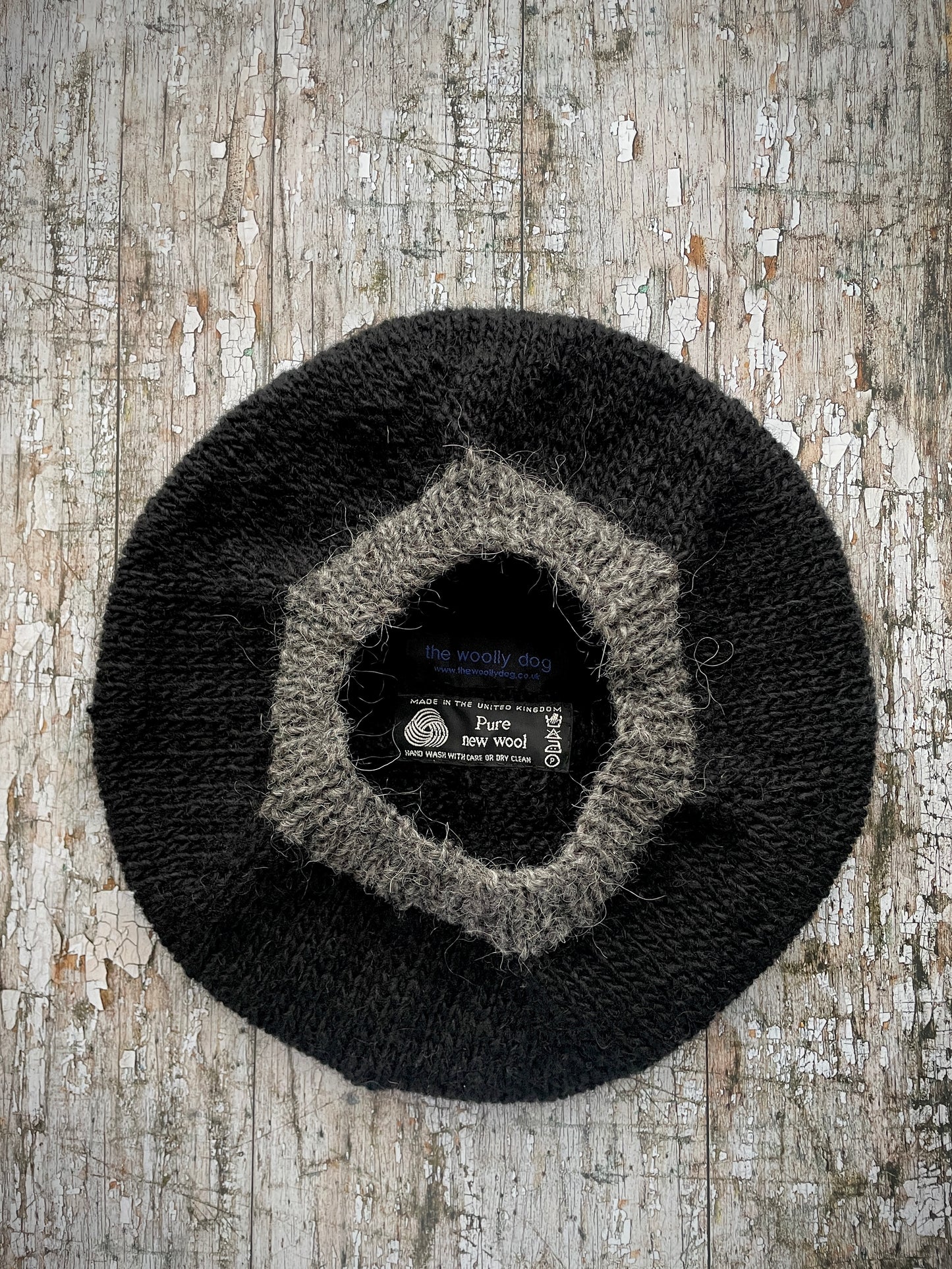 Hand Knitted Wool Black + Grey Tweed

Beautifully hand knitted beret in Icelandic pure wool, perfect for keeping your head warm on cold days, knitted in black, with a grey tweed ribbed band that gives the hat a snug fit.

SIZE: adult.

DIAMETER: 11" / 28cm.

CARE: hand wash or machine wash on wool cycle at 30 degrees, dry flat, do not tumble dry.