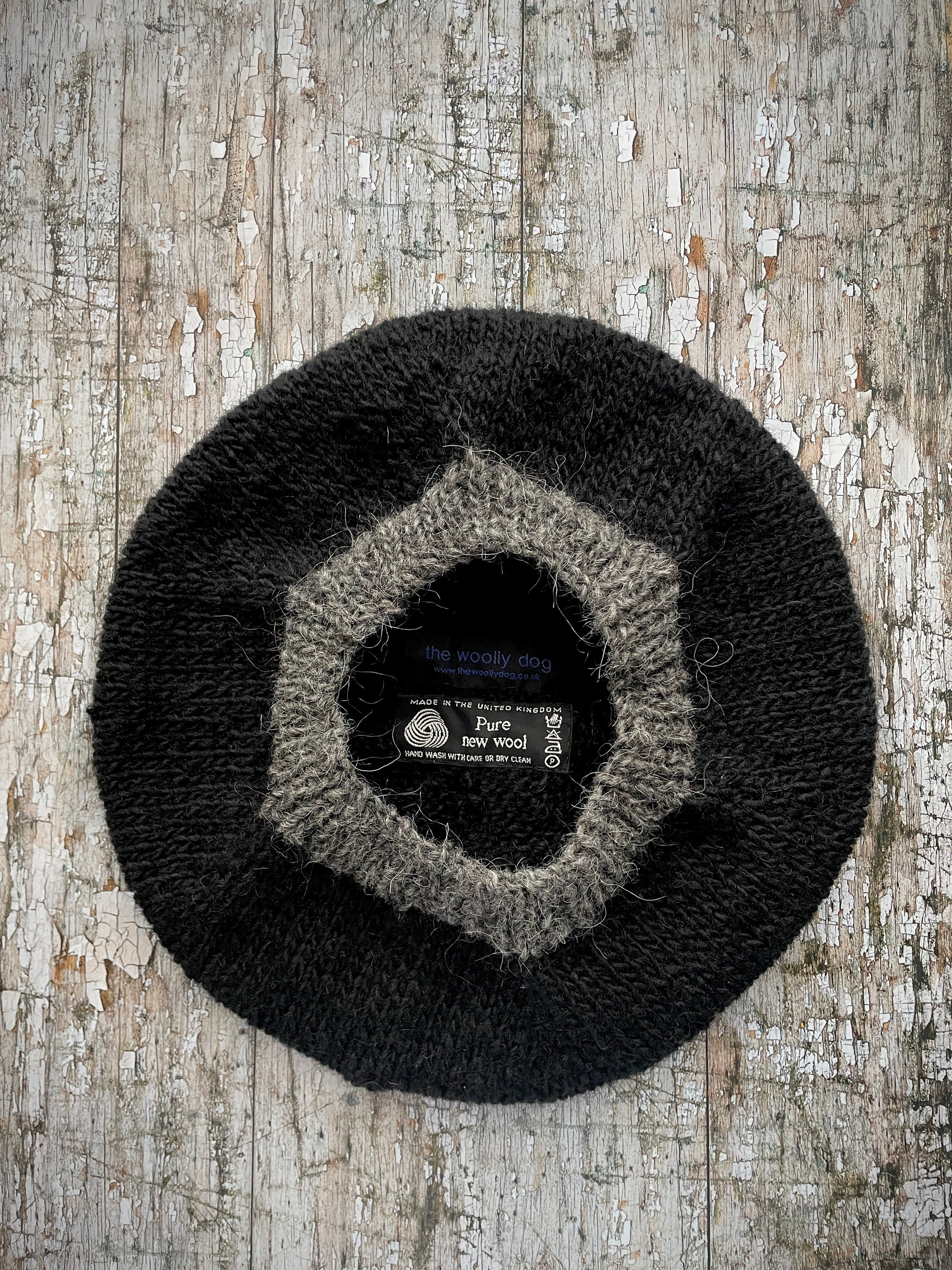 Hand Knitted Wool Black + Grey Tweed

Beautifully hand knitted beret in Icelandic pure wool, perfect for keeping your head warm on cold days, knitted in black, with a grey tweed ribbed band that gives the hat a snug fit.

SIZE: adult.

DIAMETER: 11" / 28cm.

CARE: hand wash or machine wash on wool cycle at 30 degrees, dry flat, do not tumble dry.