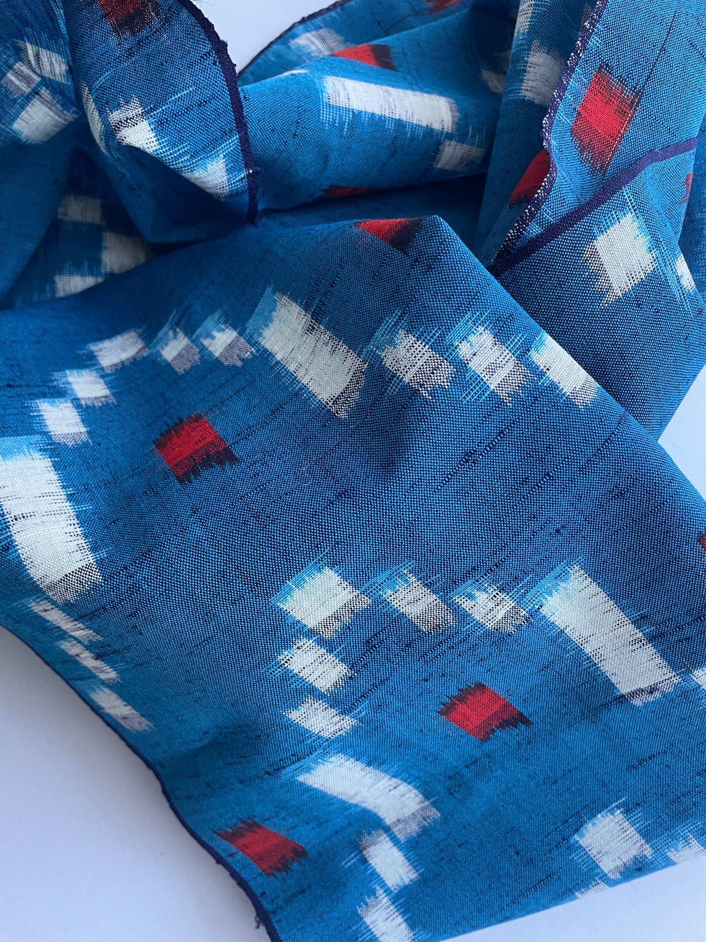 Antique Japanese Kusakizome Fabric Scarf&nbsp;

This long, medium weight, brightly patterned linen and wool scarf, has been made from antique Japanese woven Kusakizome fabric, which was originally used for making kimonos. The blue colour is a mixture of two indigo dyes and the beautiful red colour was produced by eco friendly botanical dying known as Kusakizome. The ends have been hand hemmed.