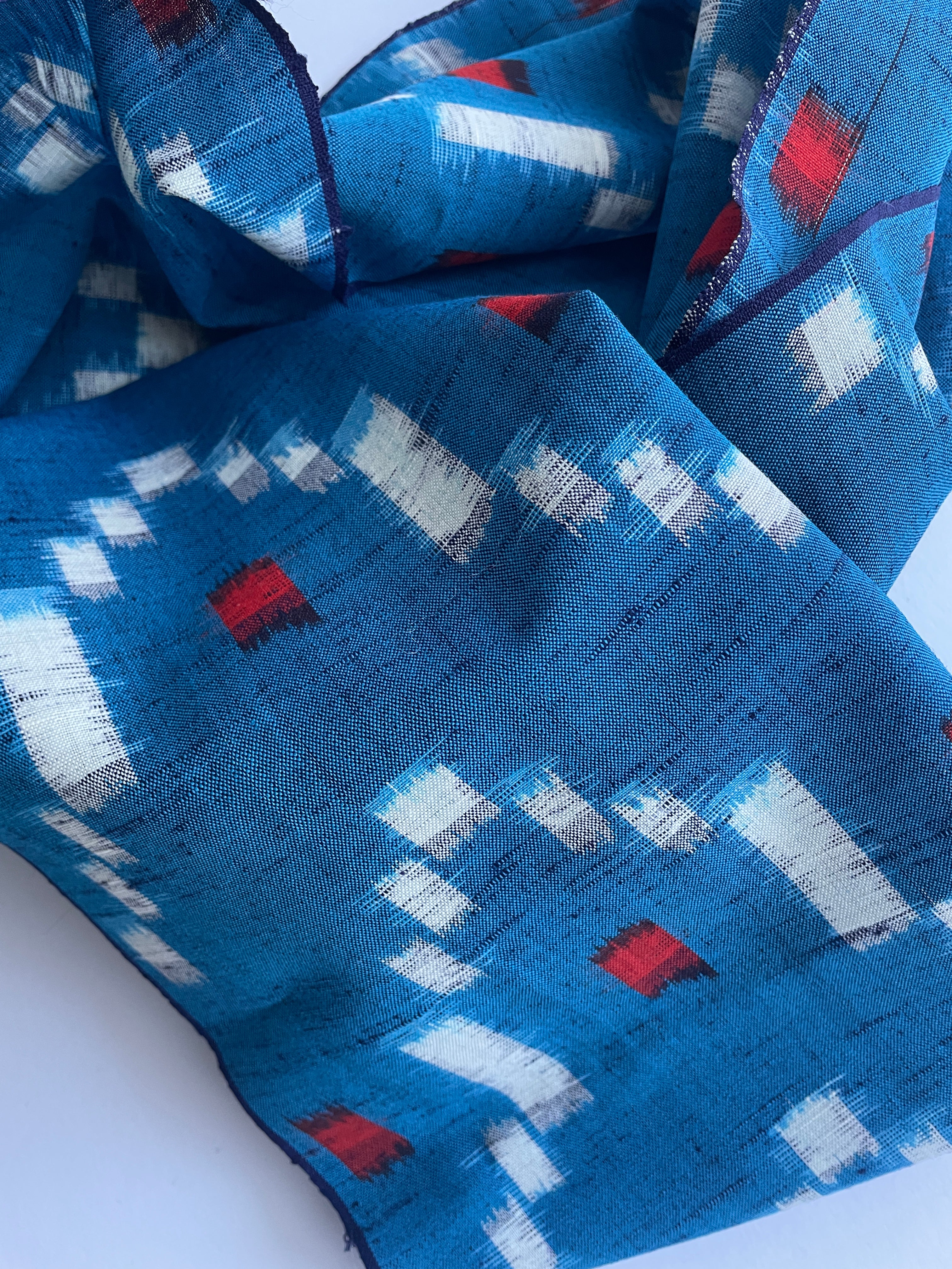 Antique Japanese Kusakizome Fabric Scarf&nbsp;

This long, medium weight, brightly patterned linen and wool scarf, has been made from antique Japanese woven Kusakizome fabric, which was originally used for making kimonos. The blue colour is a mixture of two indigo dyes and the beautiful red colour was produced by eco friendly botanical dying known as Kusakizome. The ends have been hand hemmed.