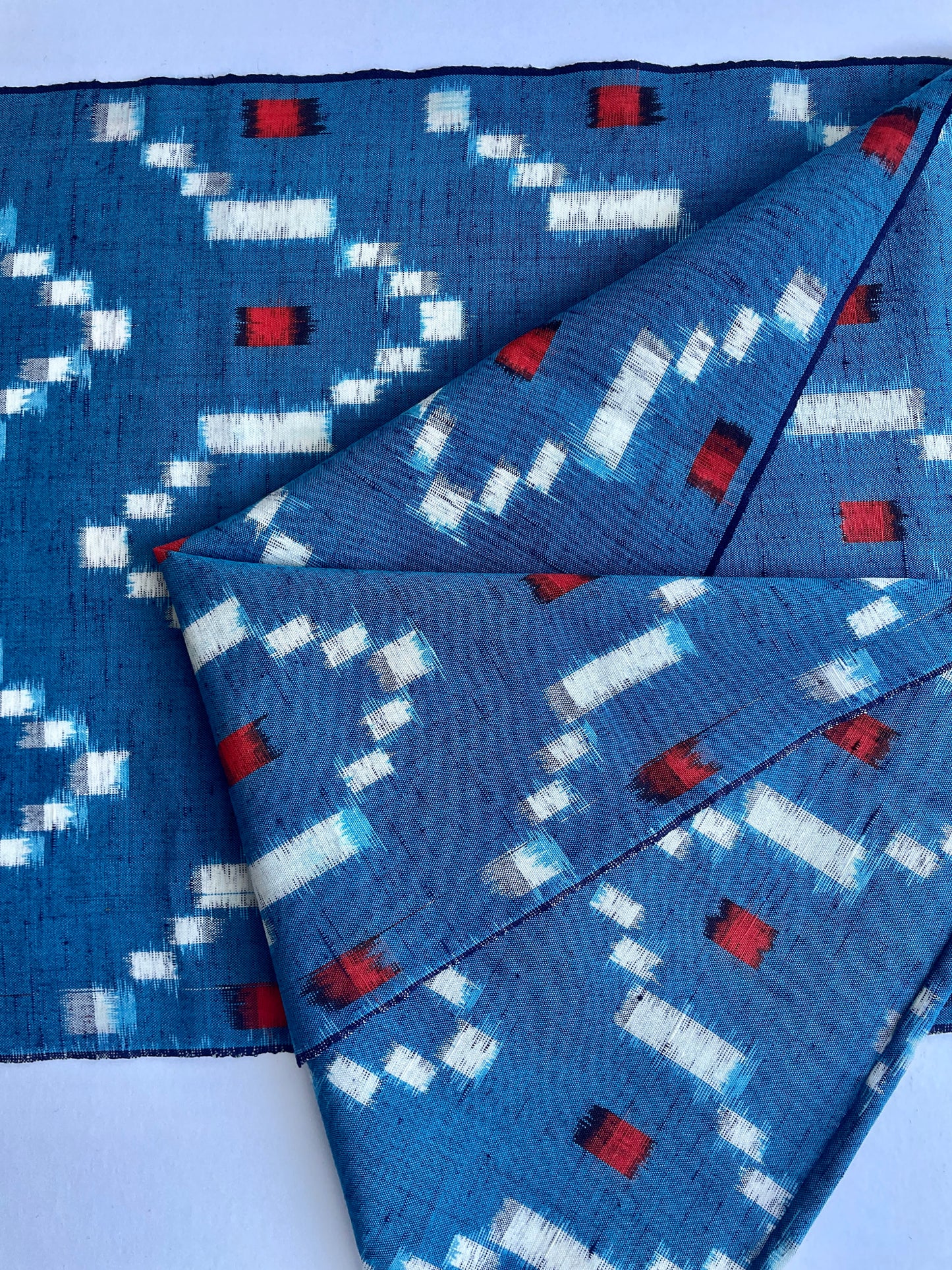 Antique Japanese Kusakizome Fabric Scarf&nbsp;

This long, medium weight, brightly patterned linen and wool scarf, has been made from antique Japanese woven Kusakizome fabric, which was originally used for making kimonos. The blue colour is a mixture of two indigo dyes and the beautiful red colour was produced by eco friendly botanical dying known as Kusakizome. The ends have been hand hemmed.