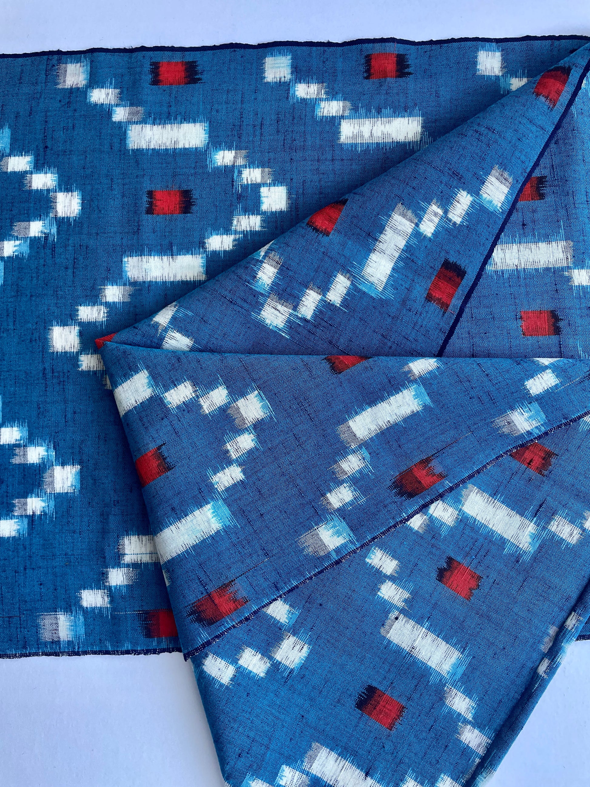 Antique Japanese Kusakizome Fabric Scarf&nbsp;

This long, medium weight, brightly patterned linen and wool scarf, has been made from antique Japanese woven Kusakizome fabric, which was originally used for making kimonos. The blue colour is a mixture of two indigo dyes and the beautiful red colour was produced by eco friendly botanical dying known as Kusakizome. The ends have been hand hemmed.