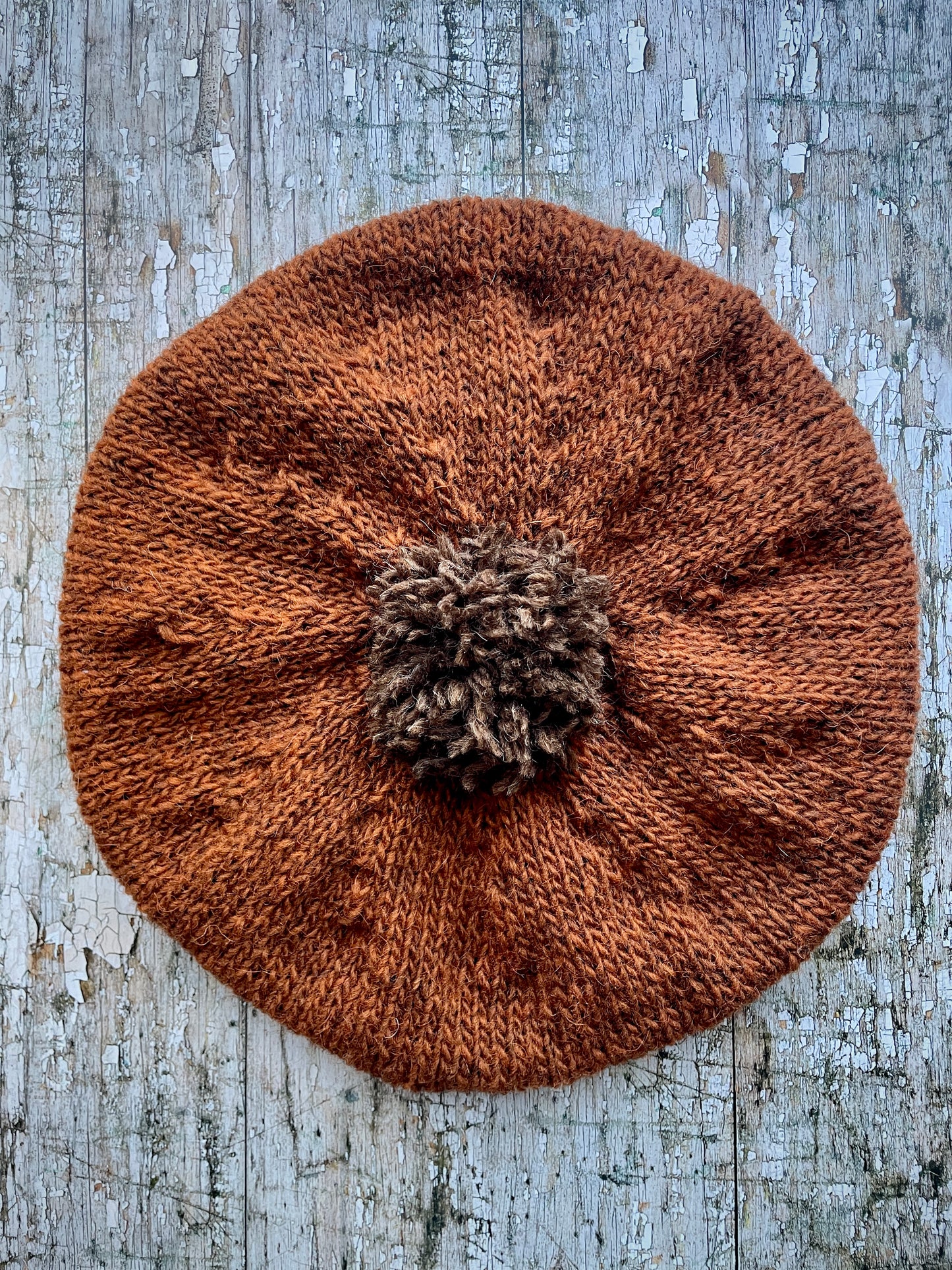 Hand Knitted Wool Beret Paprika + Dark Chocolate

Beautifully hand knitted beret in Icelandic pure wool, perfect for keeping your head warm on cold days, knitted in vibrant paprika colour, with a dark chocolate pom and ribbed band that gives the hat a snug fit.

SIZE: adult.

DIAMETER: 11" / 28cm.

CARE: hand wash or machine wash on wool cycle at 30 degrees, dry flat, do not tumble dry.