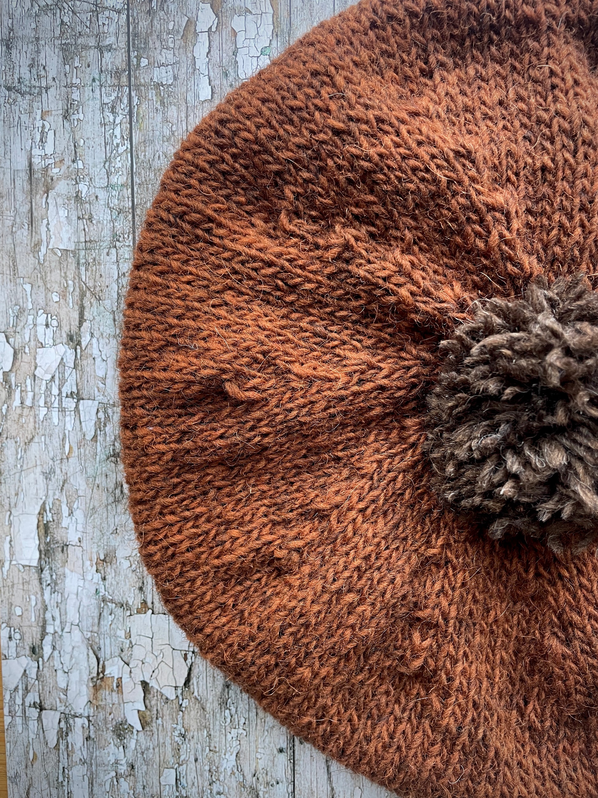 Hand Knitted Wool Beret Paprika + Dark Chocolate

Beautifully hand knitted beret in Icelandic pure wool, perfect for keeping your head warm on cold days, knitted in vibrant paprika colour, with a dark chocolate pom and ribbed band that gives the hat a snug fit.

SIZE: adult.

DIAMETER: 11" / 28cm.

CARE: hand wash or machine wash on wool cycle at 30 degrees, dry flat, do not tumble dry.