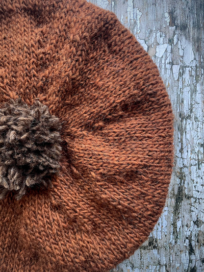 Hand Knitted Wool Beret Paprika + Dark Chocolate

Beautifully hand knitted beret in Icelandic pure wool, perfect for keeping your head warm on cold days, knitted in vibrant paprika colour, with a dark chocolate pom and ribbed band that gives the hat a snug fit.

SIZE: adult.

DIAMETER: 11" / 28cm.

CARE: hand wash or machine wash on wool cycle at 30 degrees, dry flat, do not tumble dry.