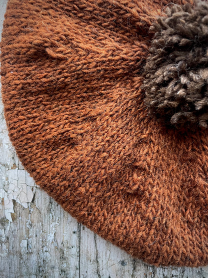 Hand Knitted Wool Beret Paprika + Dark Chocolate

Beautifully hand knitted beret in Icelandic pure wool, perfect for keeping your head warm on cold days, knitted in vibrant paprika colour, with a dark chocolate pom and ribbed band that gives the hat a snug fit.

SIZE: adult.

DIAMETER: 11" / 28cm.

CARE: hand wash or machine wash on wool cycle at 30 degrees, dry flat, do not tumble dry.