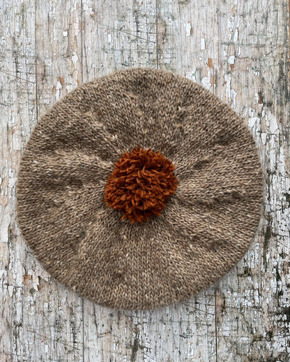 Hand Knitted Wool Beret Dark Oat + Paprika

Beautifully hand knitted beret in Icelandic pure wool, perfect for keeping your head warm on cold days, knitted in dark oat with a vibrant paprika pom and ribbed band that gives the hat a snug fit.

SIZE: adult.

DIAMETER: 11+1/2" / 29cm.

CARE: hand wash or machine wash on wool cycle at 30 degrees, dry flat, do not tumble dry.
