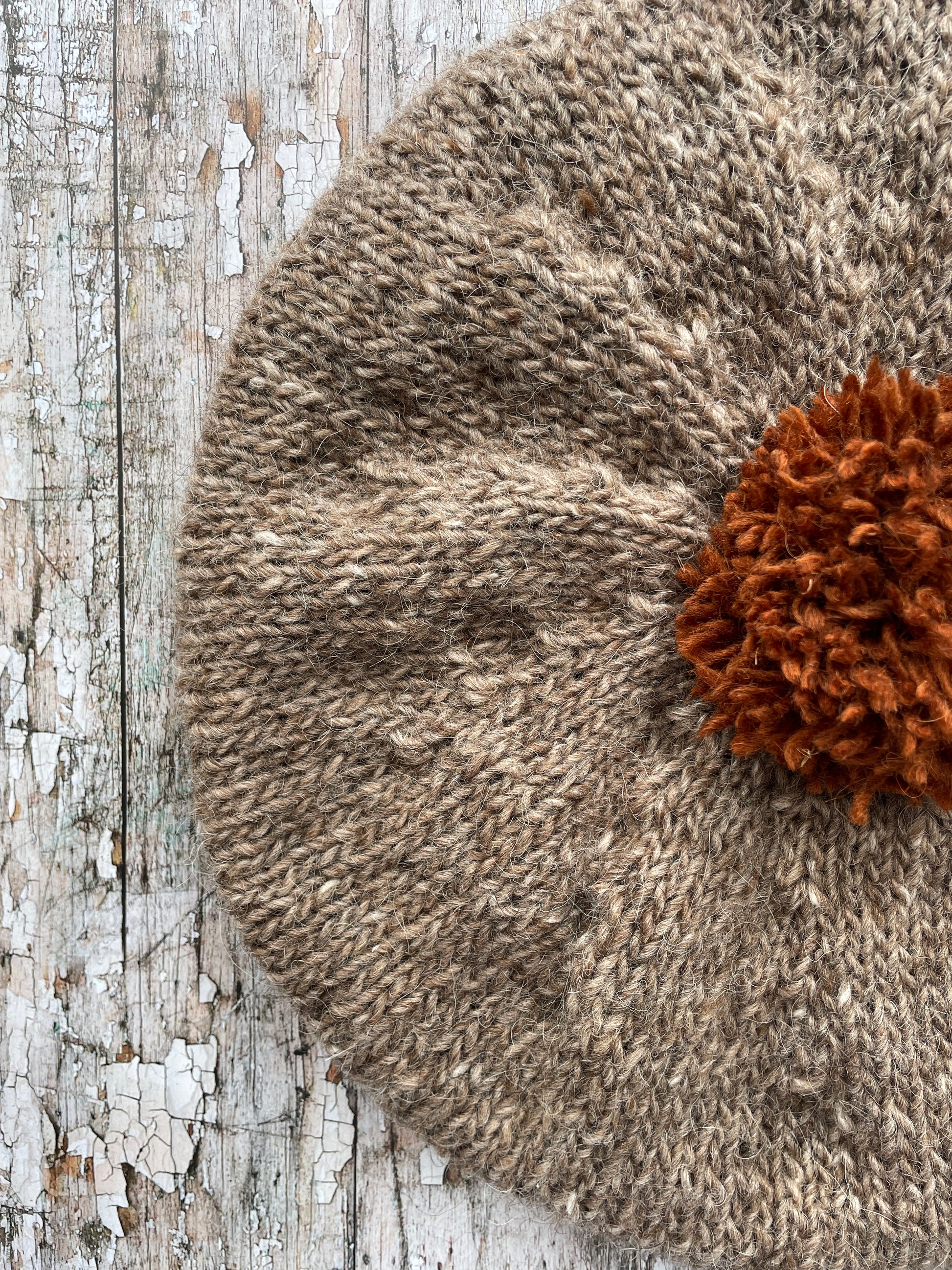 Hand Knitted Wool Beret Dark Oat + Paprika

Beautifully hand knitted beret in Icelandic pure wool, perfect for keeping your head warm on cold days, knitted in dark oat with a vibrant paprika pom and ribbed band that gives the hat a snug fit.

SIZE: adult.

DIAMETER: 11+1/2" / 29cm.

CARE: hand wash or machine wash on wool cycle at 30 degrees, dry flat, do not tumble dry.