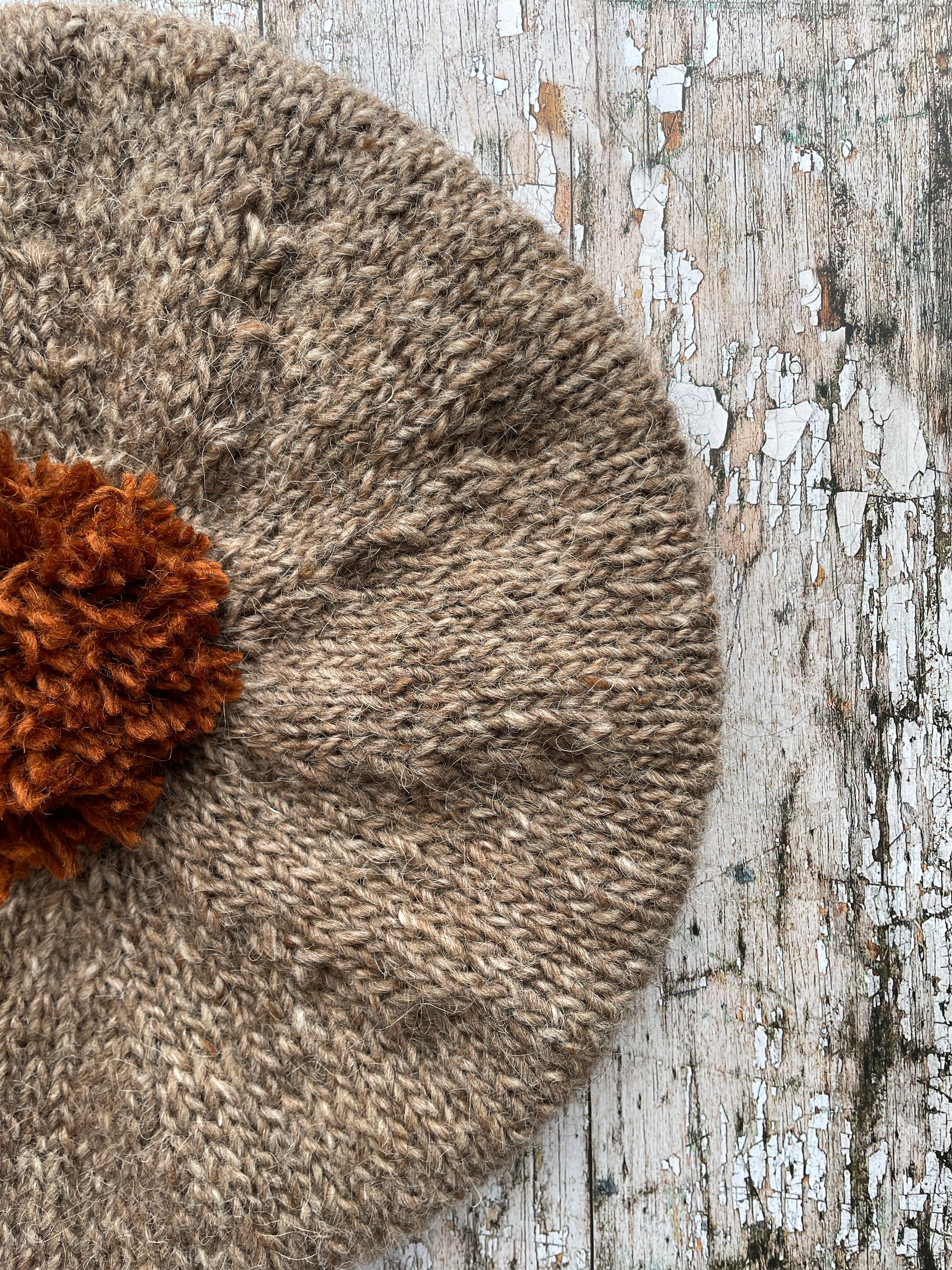 Hand Knitted Wool Beret Dark Oat + Paprika

Beautifully hand knitted beret in Icelandic pure wool, perfect for keeping your head warm on cold days, knitted in dark oat with a vibrant paprika pom and ribbed band that gives the hat a snug fit.

SIZE: adult.

DIAMETER: 11+1/2" / 29cm.

CARE: hand wash or machine wash on wool cycle at 30 degrees, dry flat, do not tumble dry.