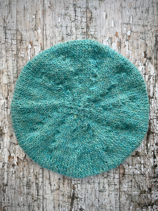 Hand Knitted Wool Beret Aqua Heather

Beautifully hand knitted beret in Icelandic pure wool, perfect for keeping your head warm on cold days and knitted in a lovely aquamarine colour, with a ribbed band that gives the hat a snug fit.

SIZE: adult.

DIAMETER: 11+1/4" / 28.5cm.

CARE: hand wash or machine wash on wool cycle at 30 degrees, dry flat, do not tumble dry.